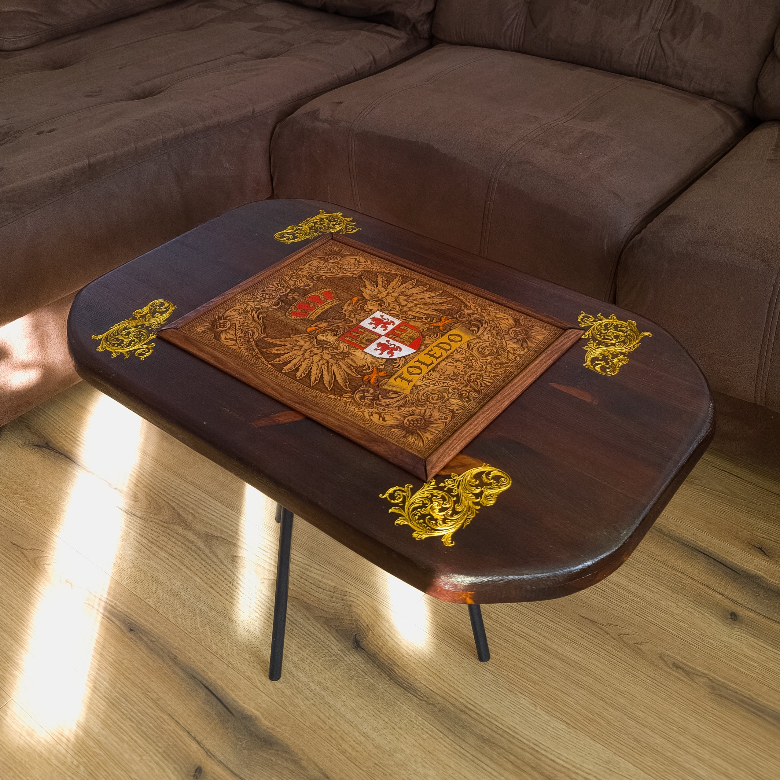Handmade walnut stained wood coffee table with engraved hand-painted Toledo family crest cedar inlay