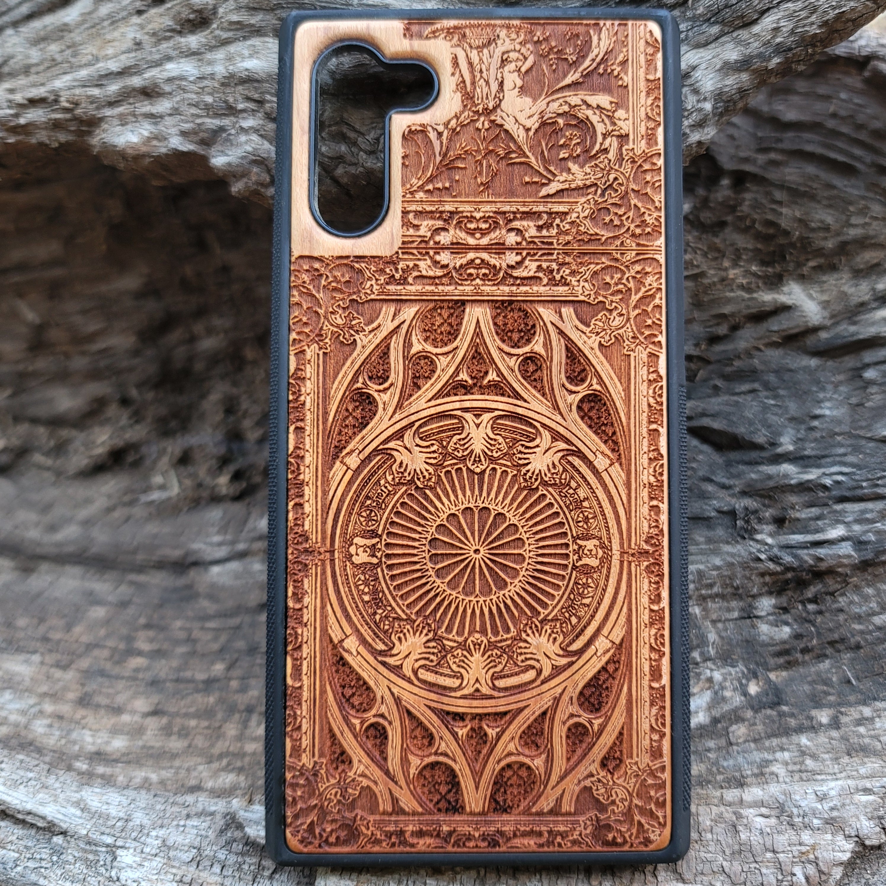 Wooden phone case with intricate gothic pattern, laser-engraved for iPhone , iPhone 15, Samsung Galaxy S, S24, Note 20. Durable and unique, perfect for gothic art fans and collectors.