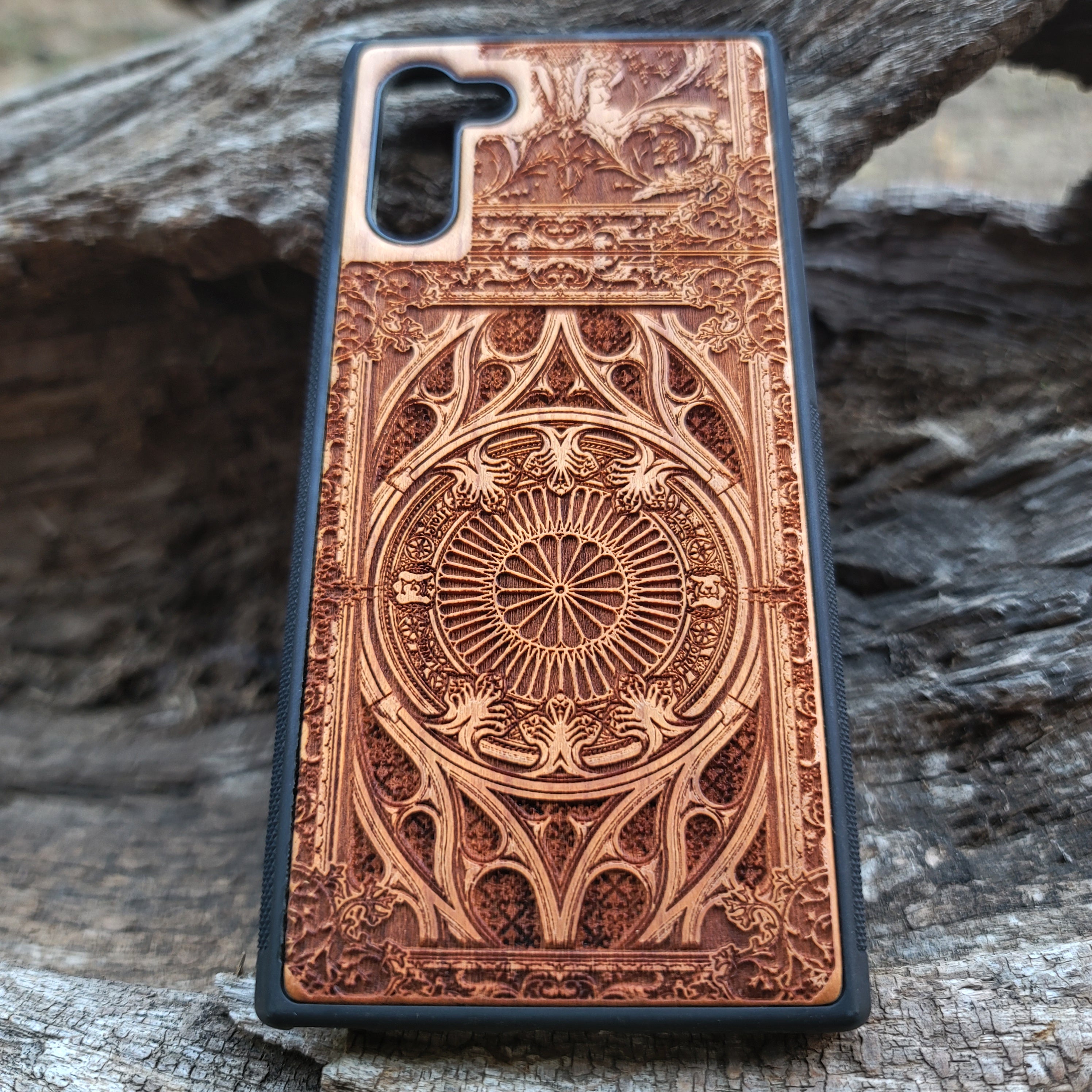 Wooden phone case with intricate gothic pattern, laser-engraved for iPhone , iPhone 15, Samsung Galaxy S, S24, Note 20. Durable and unique, perfect for gothic art fans and collectors.