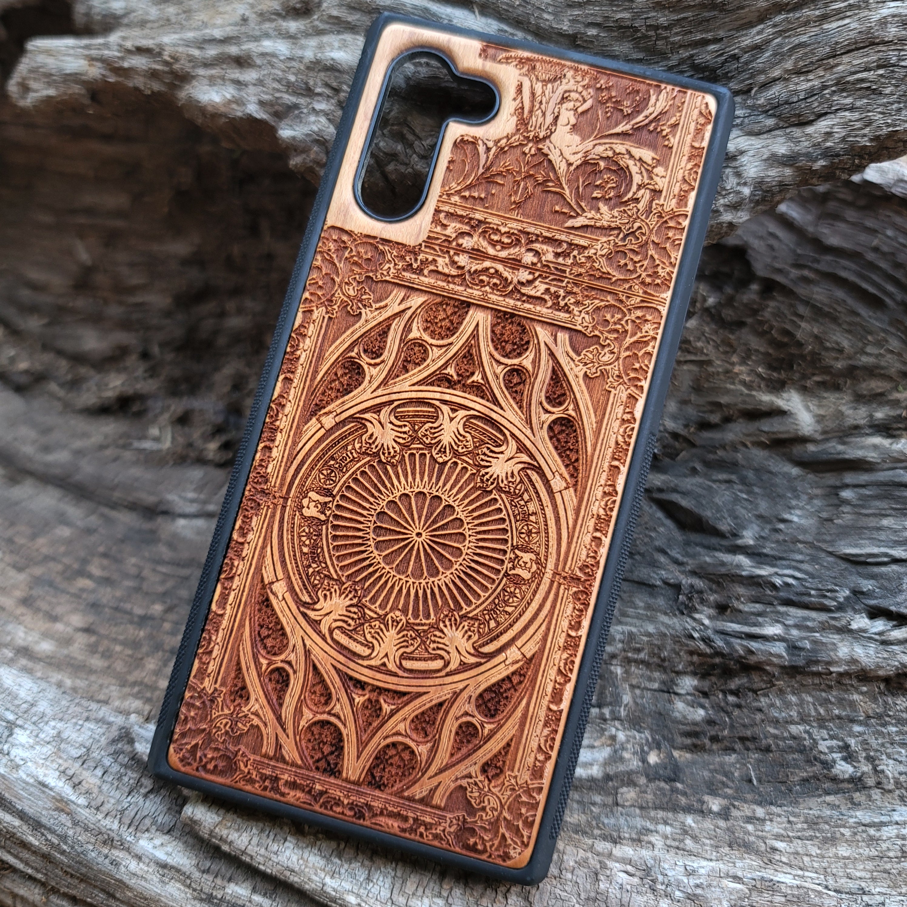 Wooden phone case with intricate gothic pattern, laser-engraved for iPhone , iPhone 15, Samsung Galaxy S, S24, Note 20. Durable and unique, perfect for gothic art fans and collectors.
