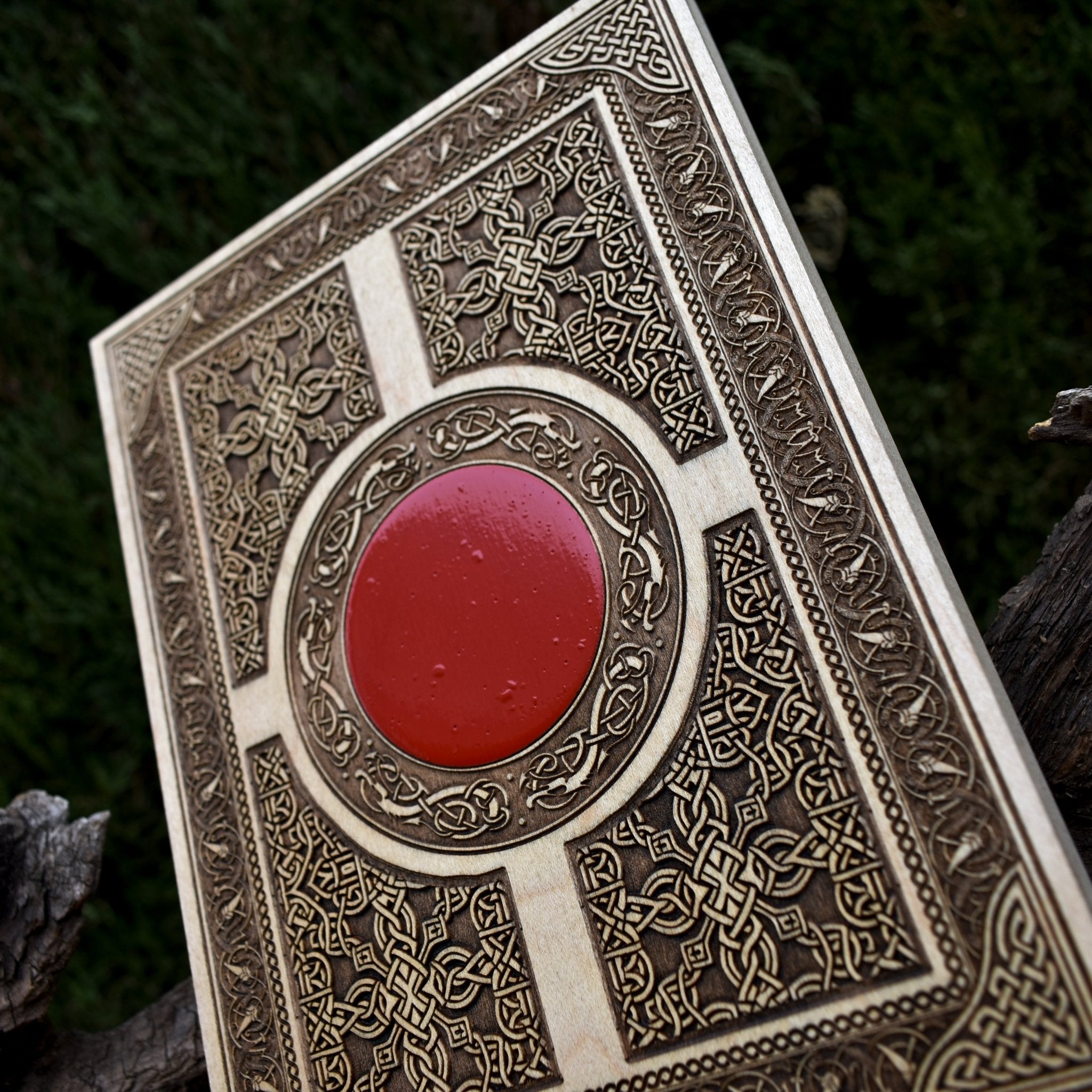 Custom wood engraving featuring a traditional Celtic window design