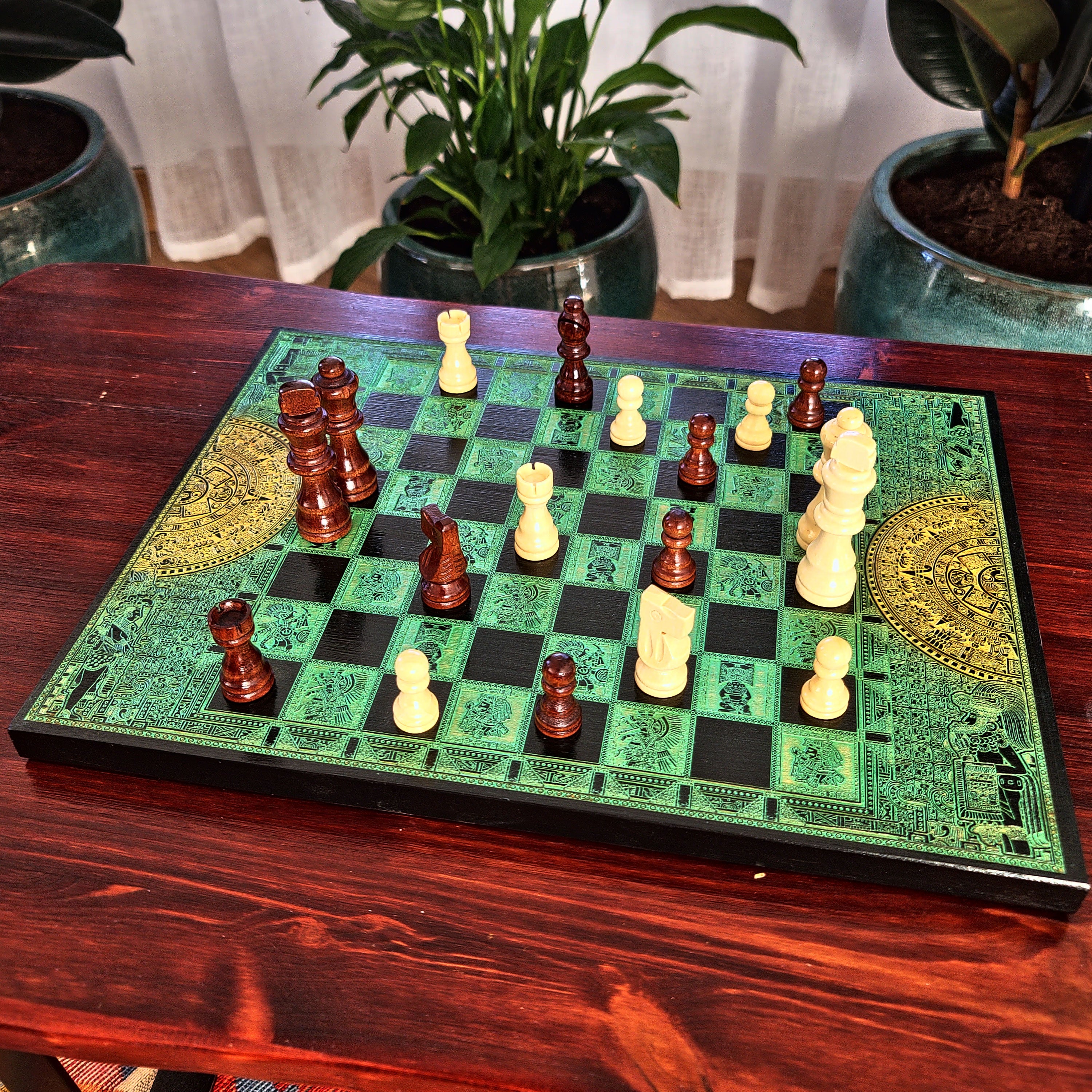 green and black wood chessboard laser engraved with mayan symbols and aztec calendar