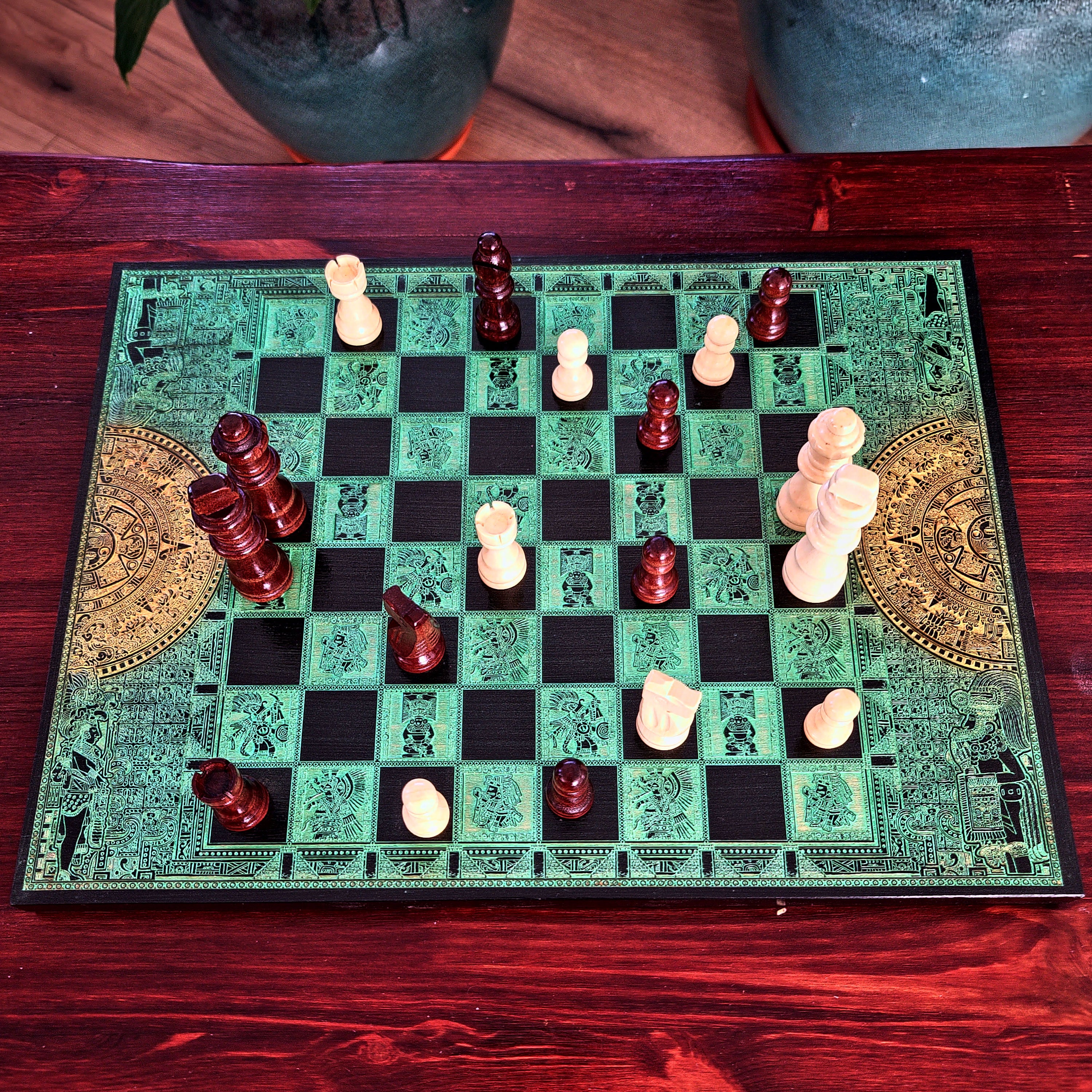 green and black wood chessboard laser engraved with mayan symbols and aztec calendar
