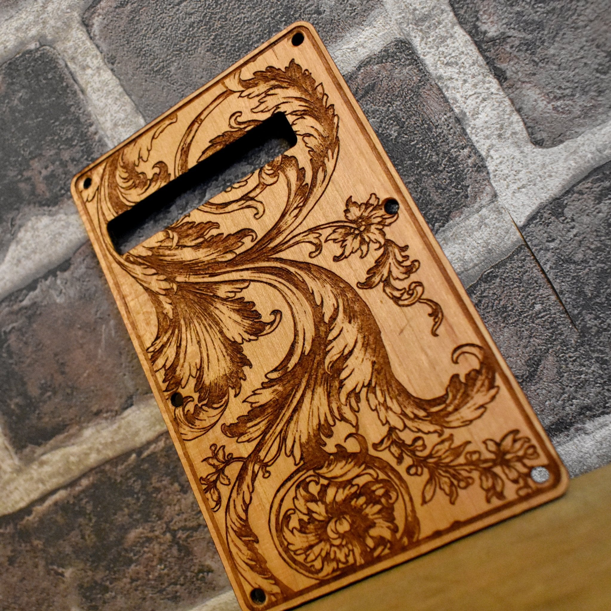 Floral 1 tremolo cover, precision-cut wood replacement part for electric guitars.