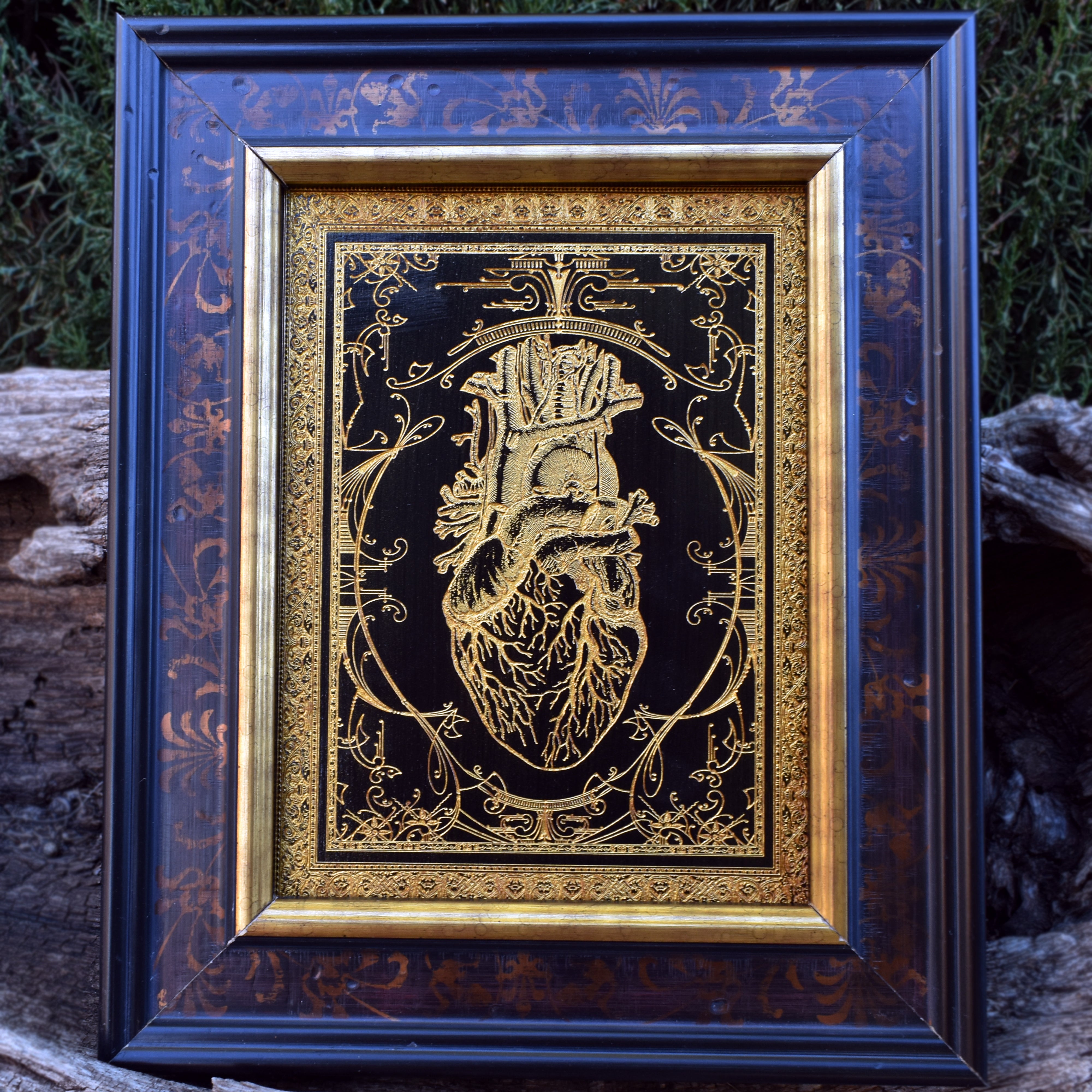 "Mini anatomical heart on wood with black and gold detailing