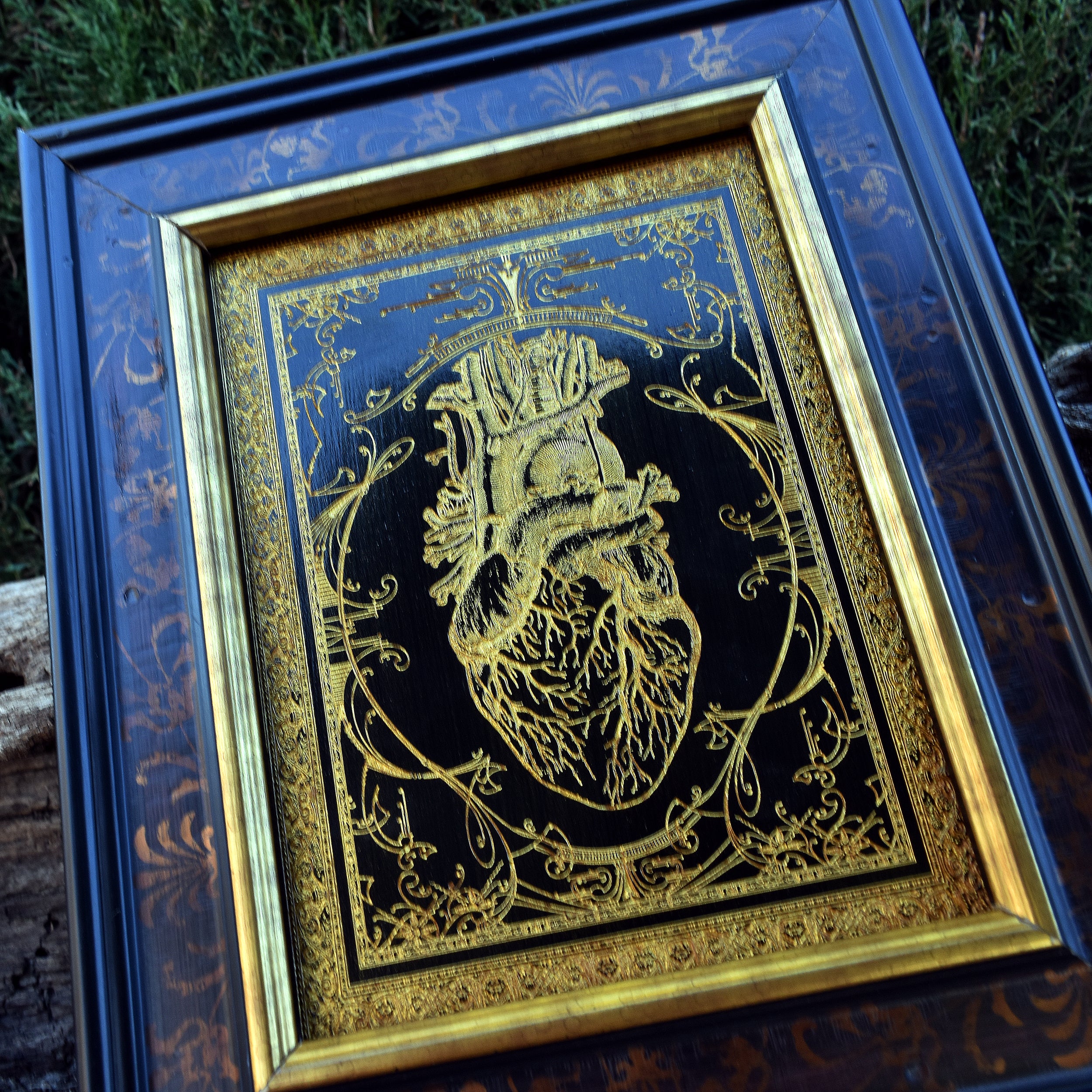 Handcrafted anatomical heart artwork on wood with gold fill