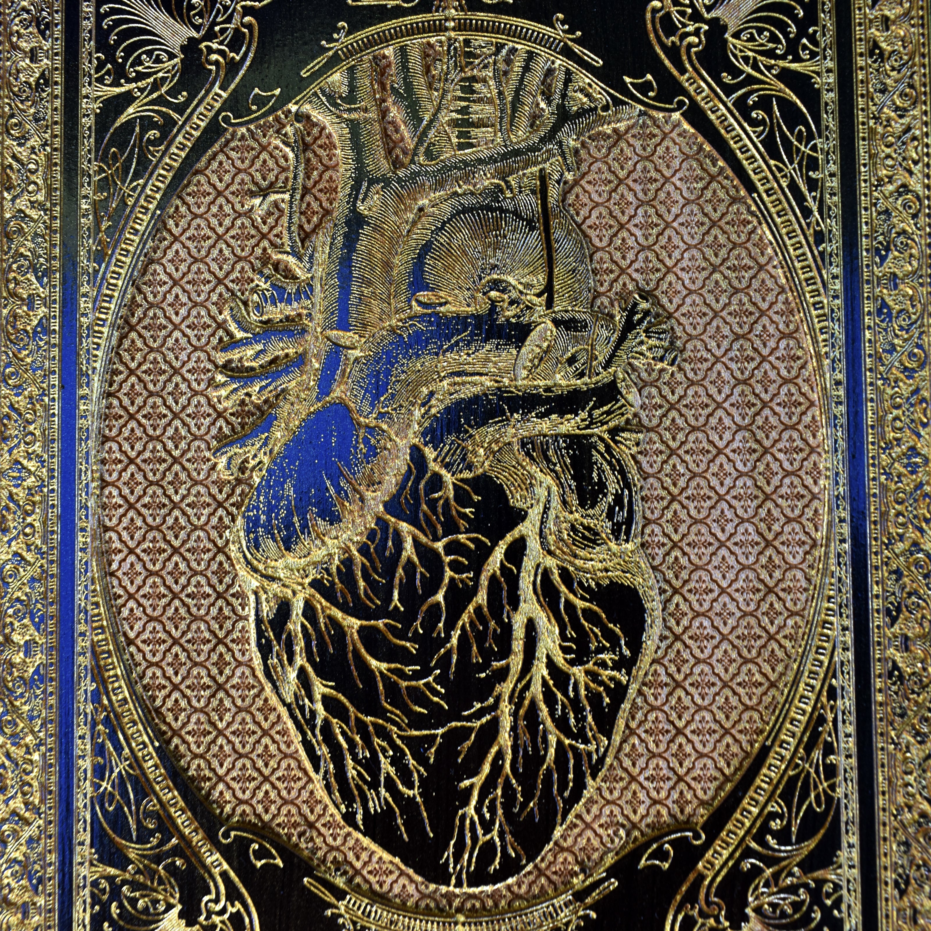 Gothic anatomical heart wall art, black-painted design with gold filling on high-quality wood.