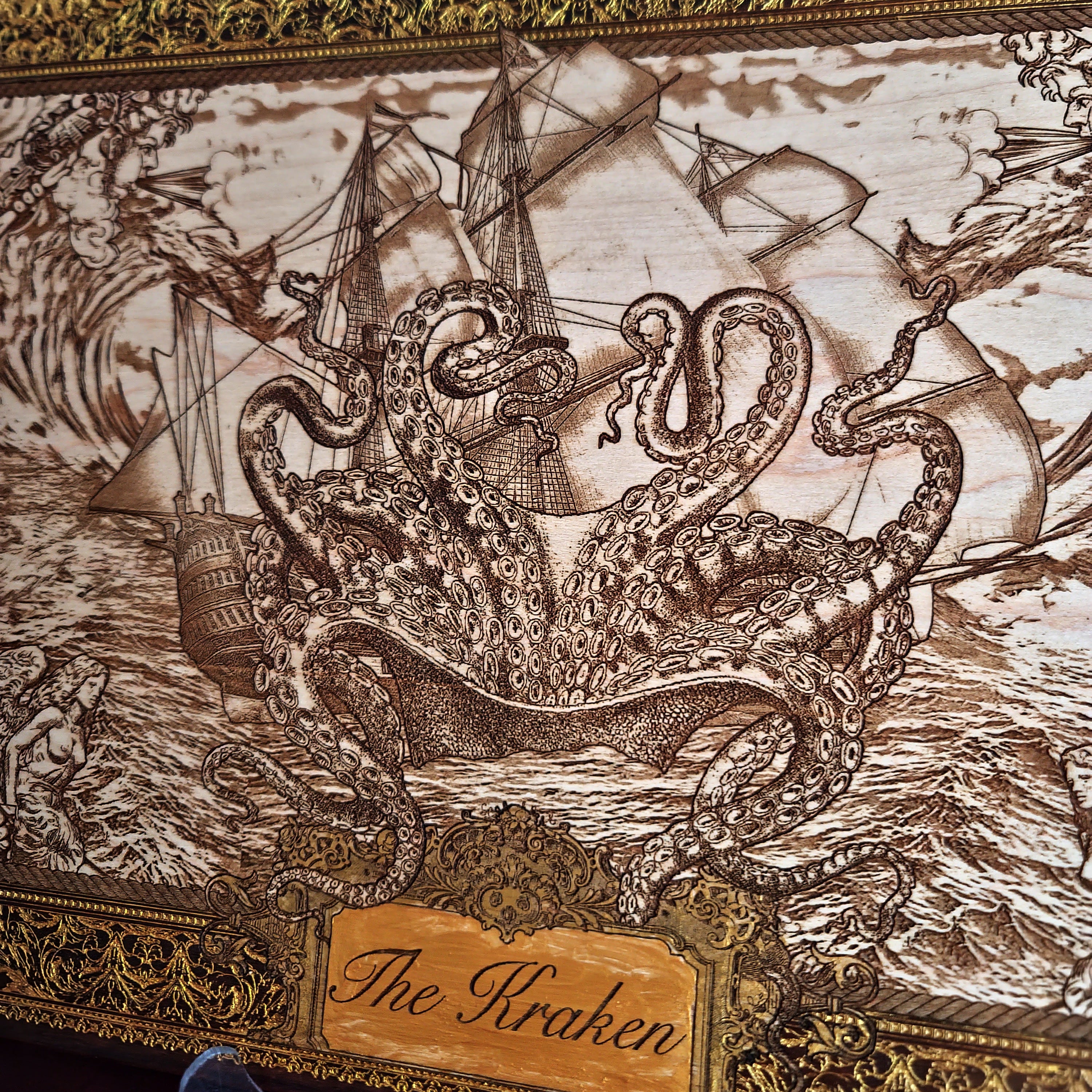 Extra-large Kraken engraved wood wall art, detailed view of the Kraken rising beneath a tall ship