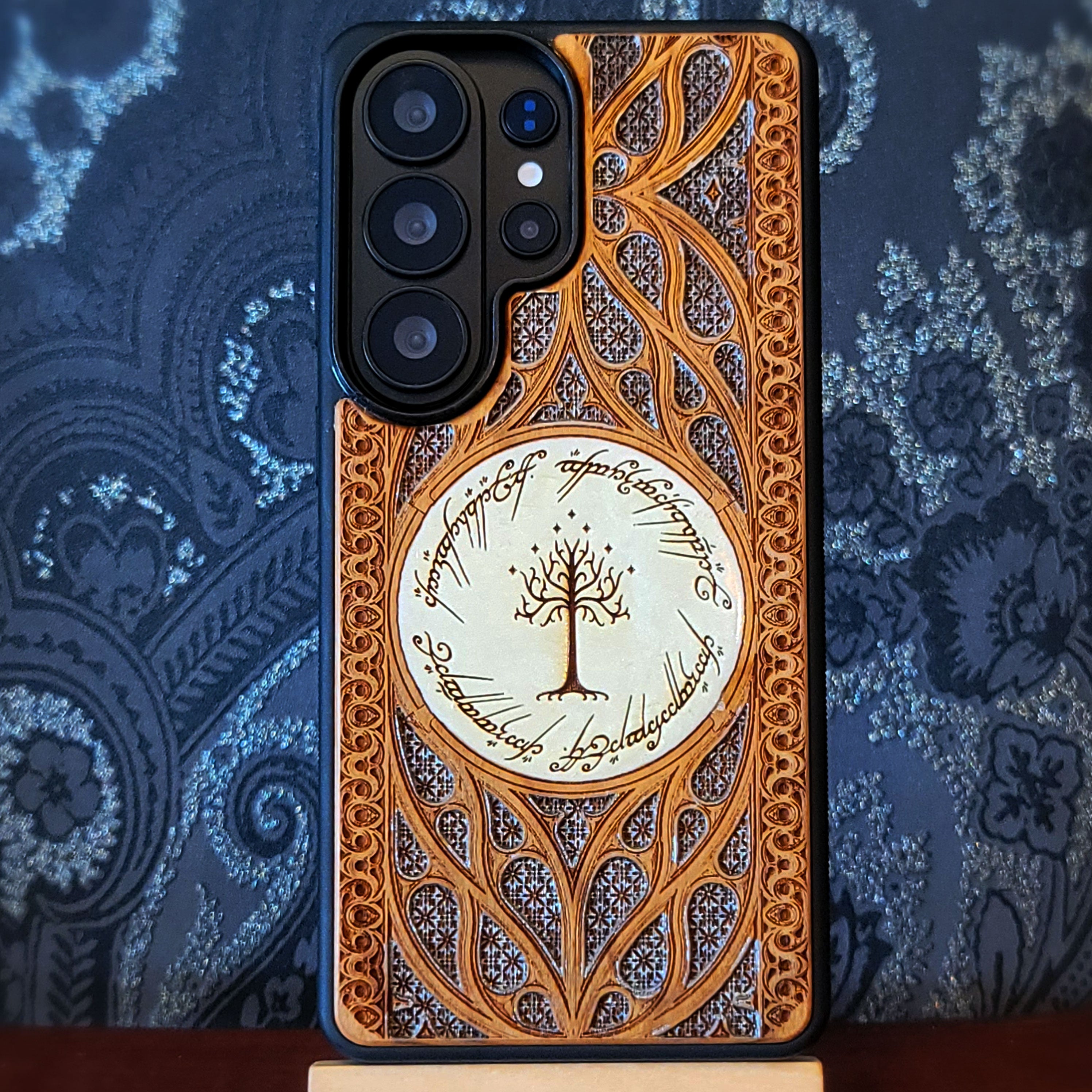 Wooden phone case for iPhone and Samsung Galaxy featuring a runic inscription and Gothic pattern design, laser-engraved for a unique look. Slim, durable, and compatible with iPhone 17, 16, 15, 14, 13, 12, 11 Pro Max Mini, and Samsung Galaxy S26, S25, S24, S23, S22, S21, S20 Ultra, Plus, Note 20. Order now for a stylish and functional phone upgrade!