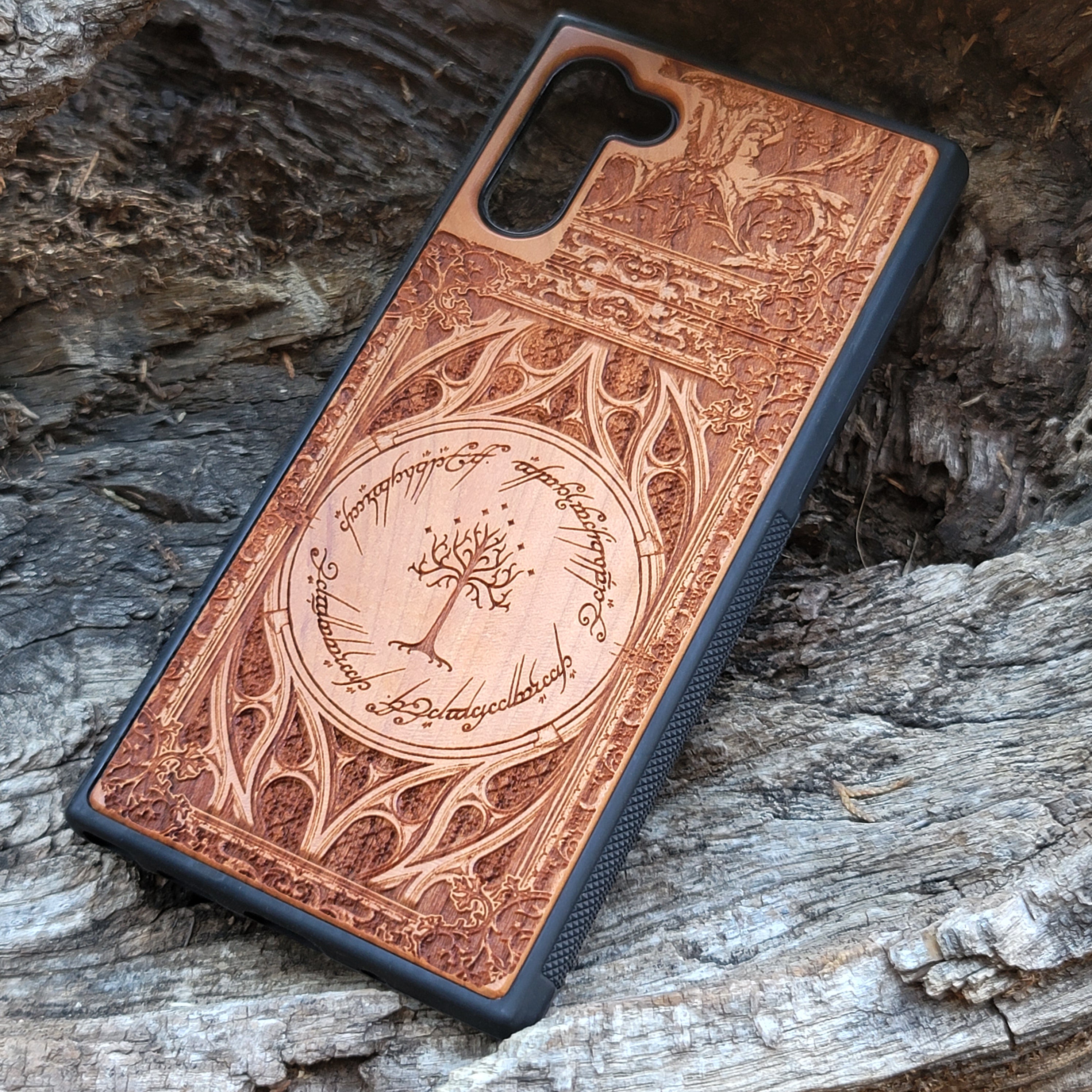 Gothic design wood phone case featuring intricate laser-engraved patterns inspired by Lord of the Rings. Compatible with iPhone , iPhone 15, 14, 13, 12, 11 Pro Max Mini, and Samsung Galaxy S, S24, S23, S22, S21, S20 Ultra, Plus, Note 20. Durable, slim, and stylish for Tolkien fans.