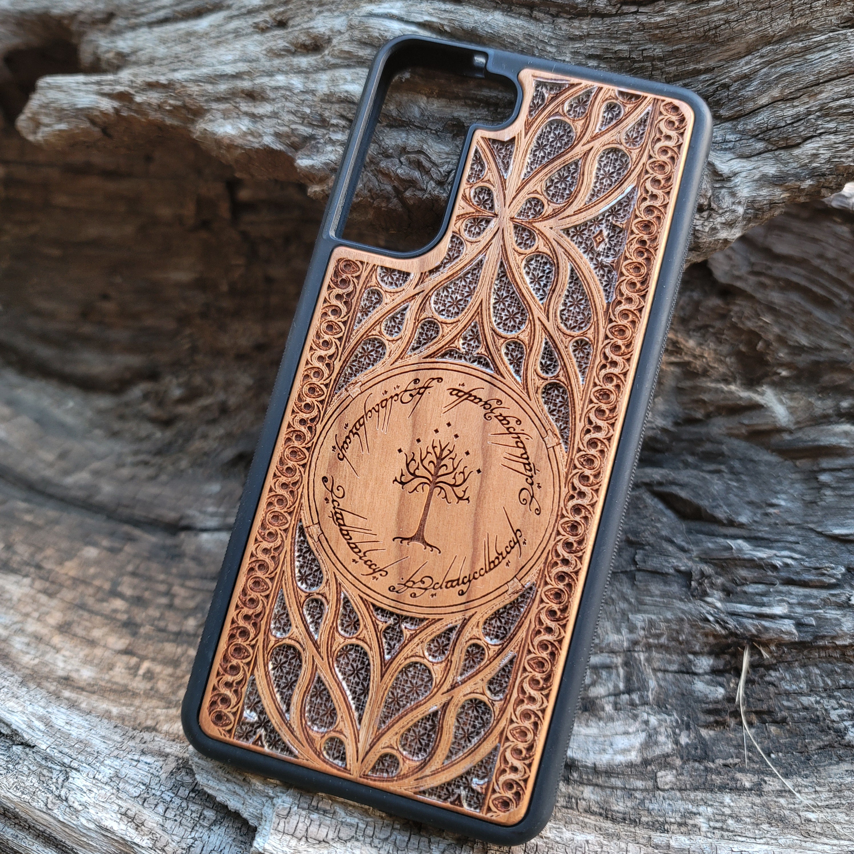 Lord of the Rings Gothic Design IV Silver wood phone case featuring intricate laser-engraved Gothic patterns. Compatible with iPhone , 15, 14, 13, 12, 11 Pro Max Mini, and Samsung Galaxy S, S24, S23, S22, S21, S20 Ultra Plus, Note 20. A unique and protective accessory for fans of the Lord of the Rings series.