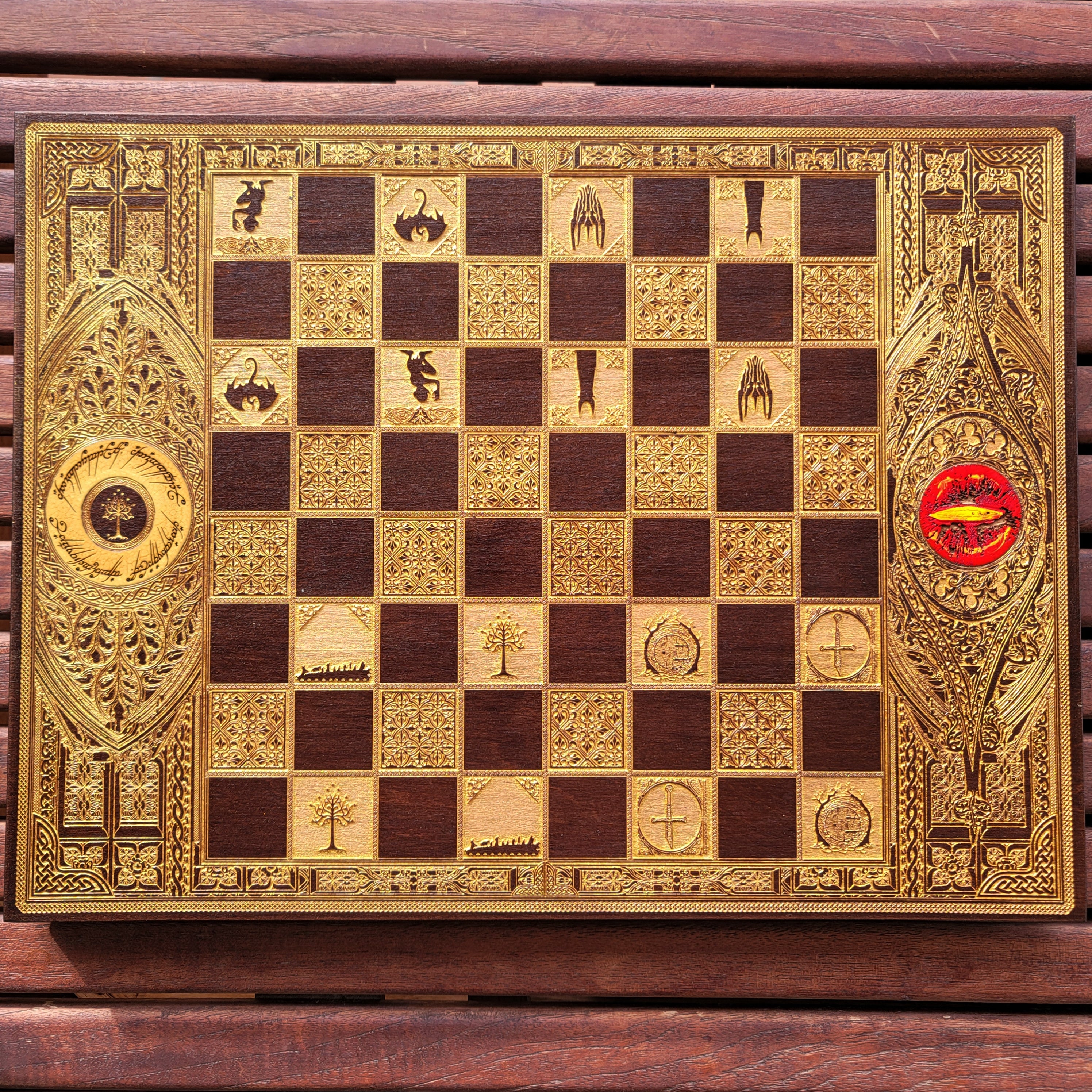 Handcrafted walnut chess board with gold-stained Lord of the Rings engravings, perfect for 5-year anniversaries.
