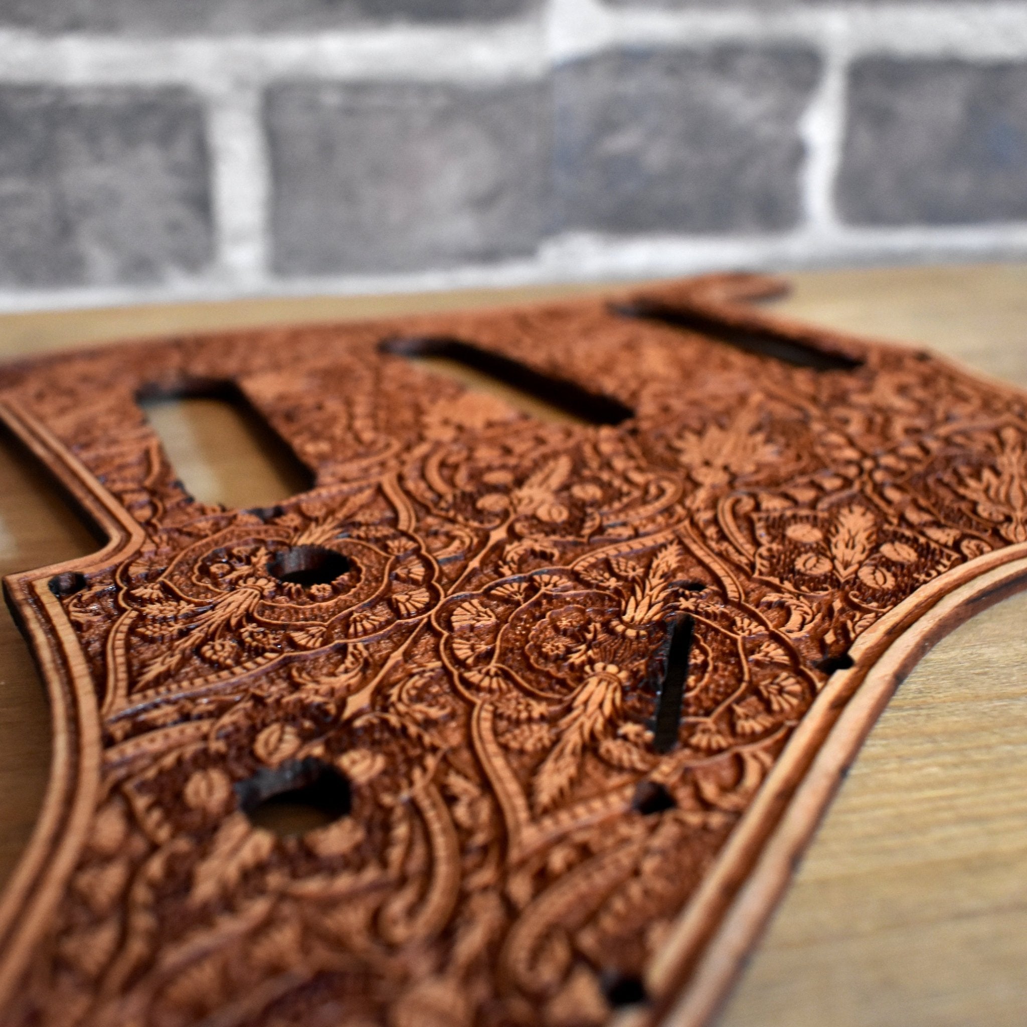 Hand-finished cherry wood pickguard for Fender Stratocaster, custom-designed for unique guitar aesthetics
