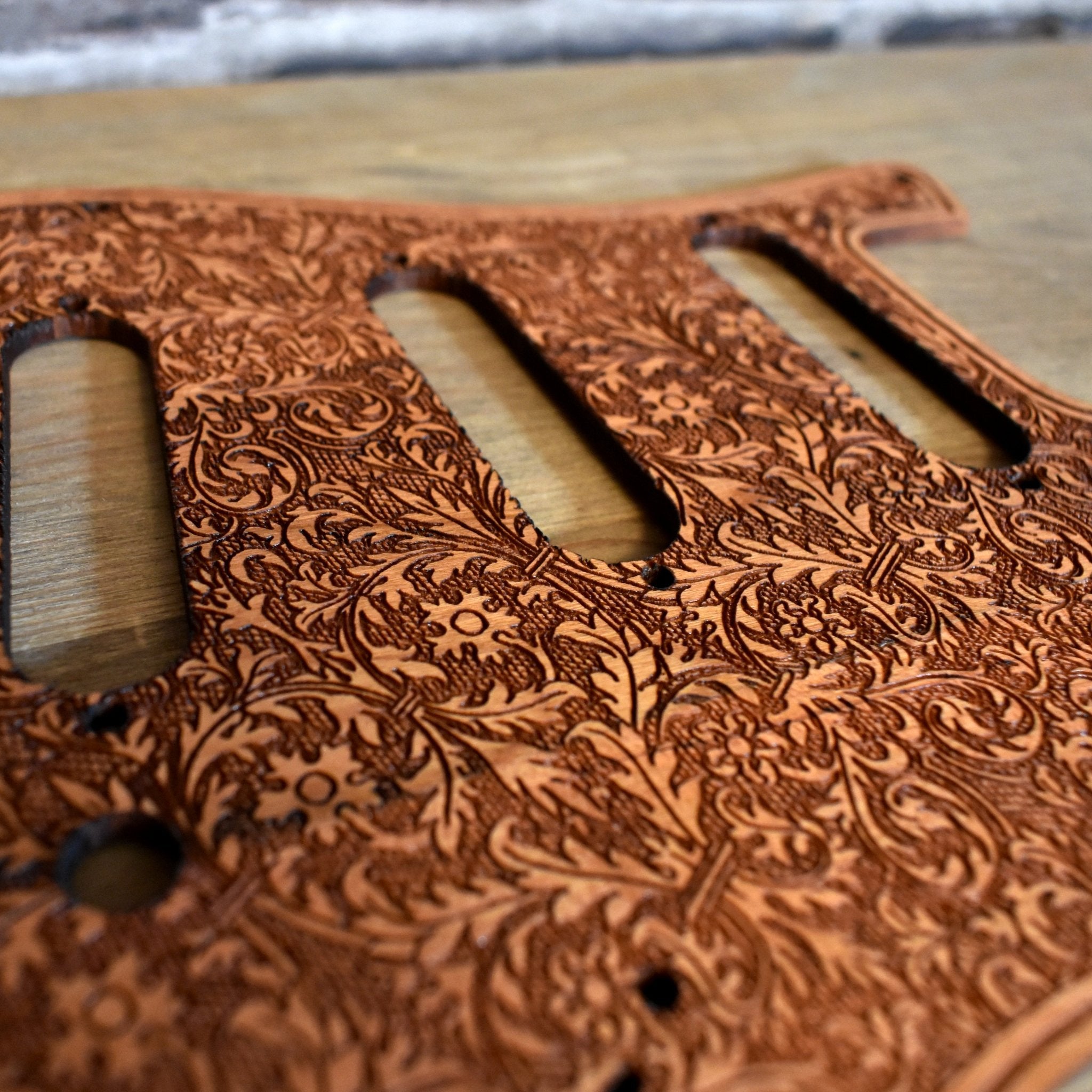 Premium handcrafted cherry wood pickguard with deep laser engraving for Fender Stratocaster