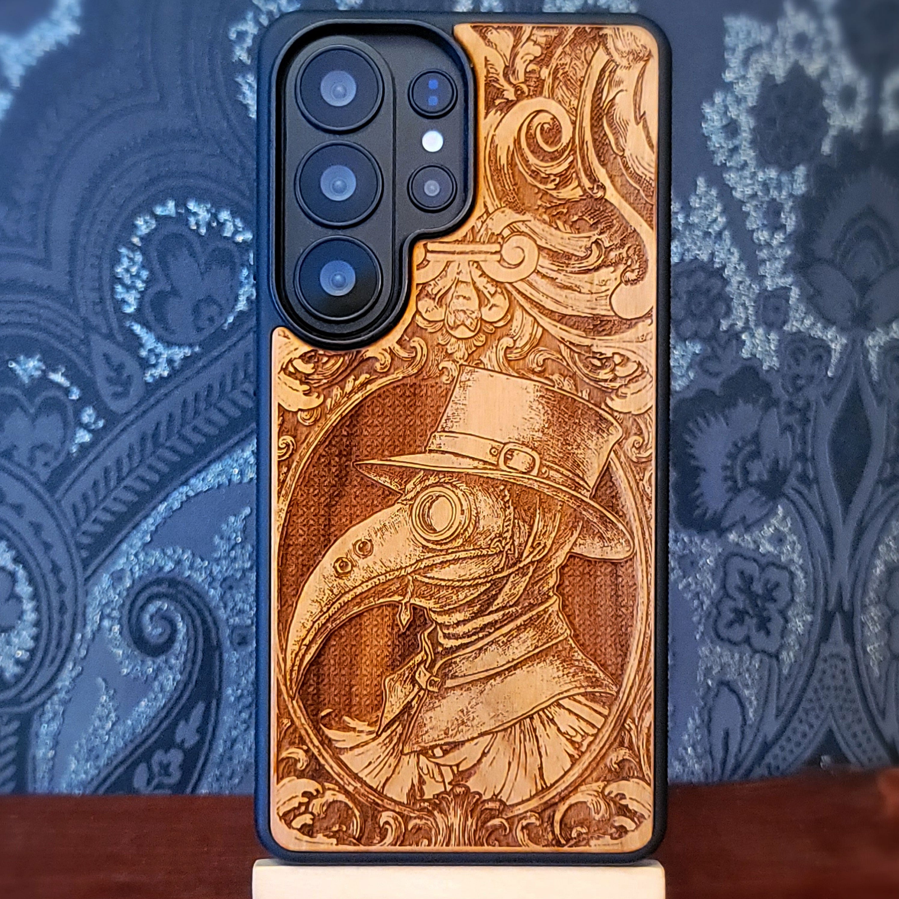 Deep laser engraved wooden phone case featuring a gothic Plague Doctor design on natural wood for iPhone and Samsung Galaxy.