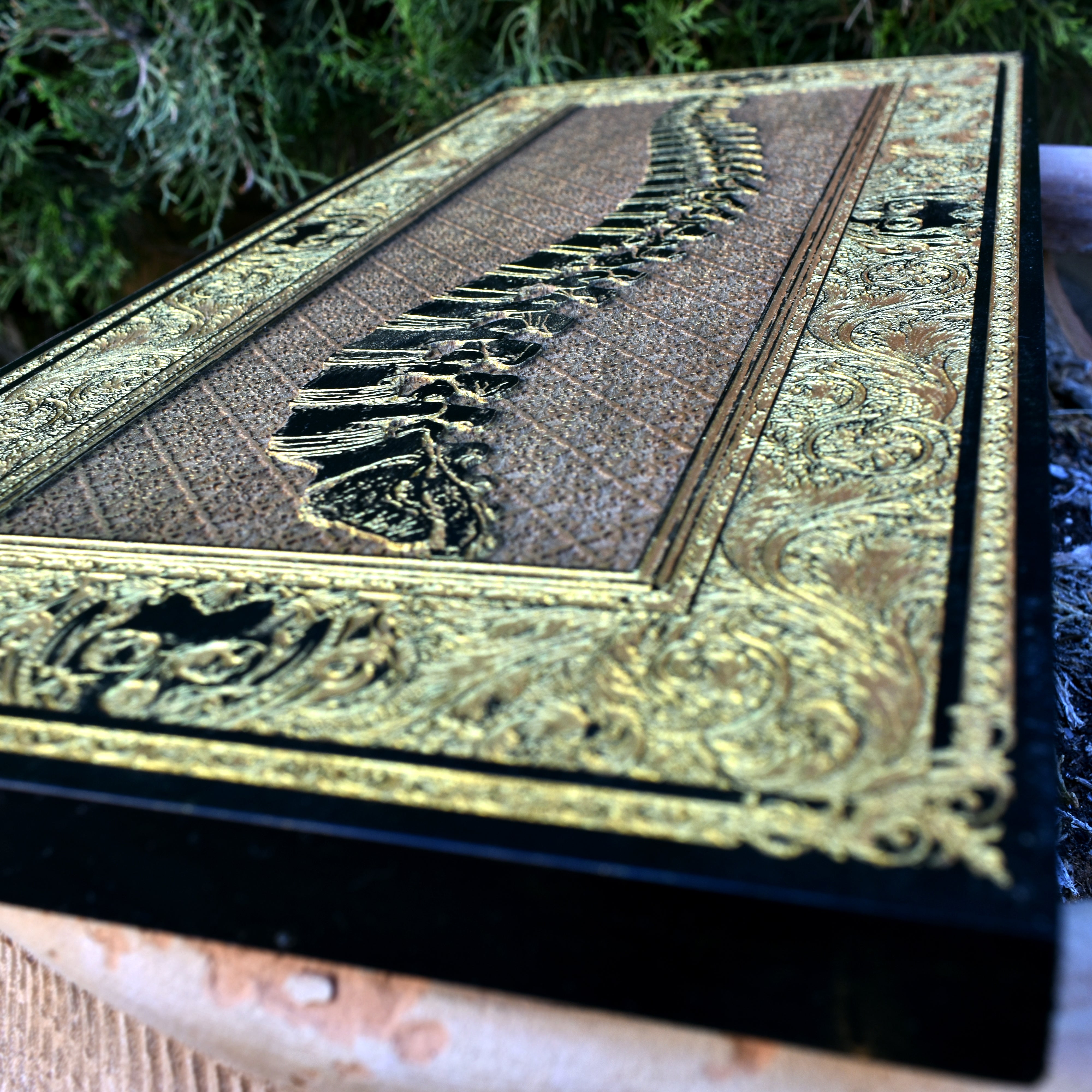 Macabre bone wall hanging with detailed spine engraving