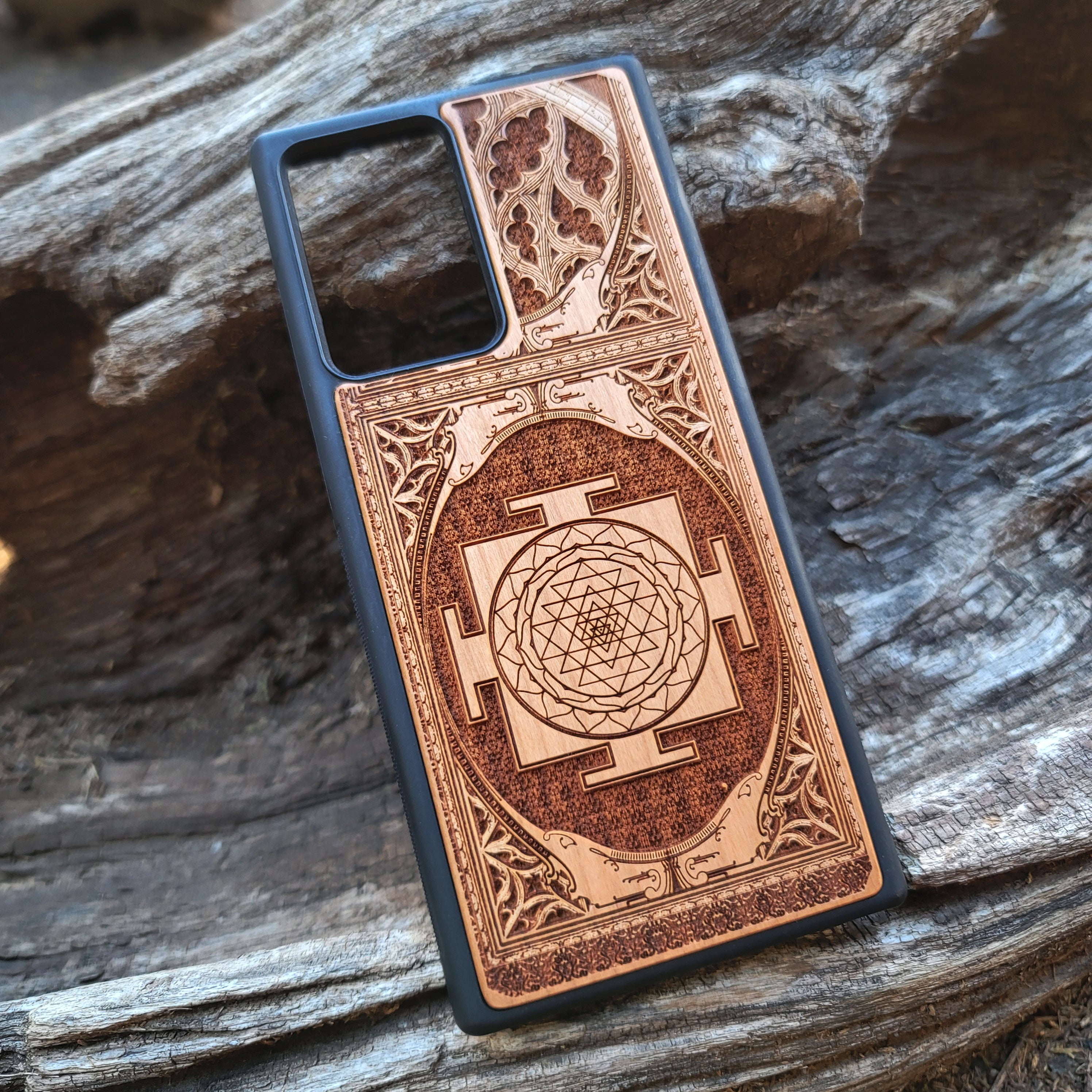 Wood phone case for iPhone & Samsung Galaxy featuring intricate Sri Yantra Chakra design. Laser-engraved with Gothic patterns, offering a unique, spiritual aesthetic. Slim, durable, and compatible with iPhone 15, 14, 13, 12, 11 Pro Max Mini & Samsung Galaxy S24, S23, S22, S21, S20 Ultra Plus Note 20. Stylish, protective, and personalized—order now!