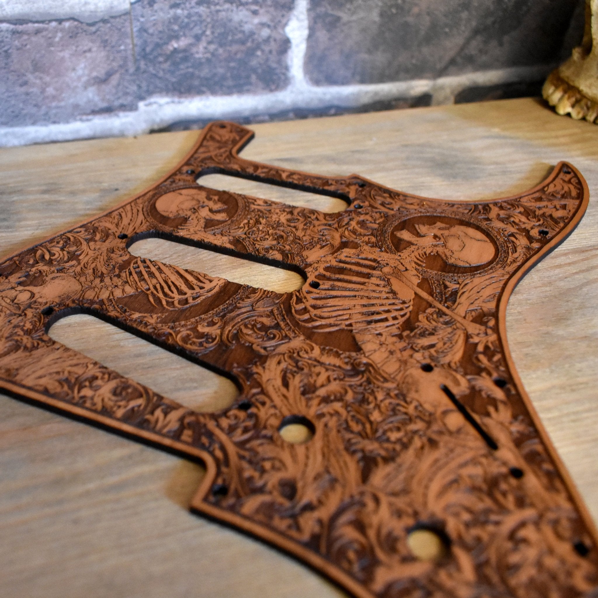 Hand-finished cherry wood guitar pickguard with unique engraving for Fender Strato