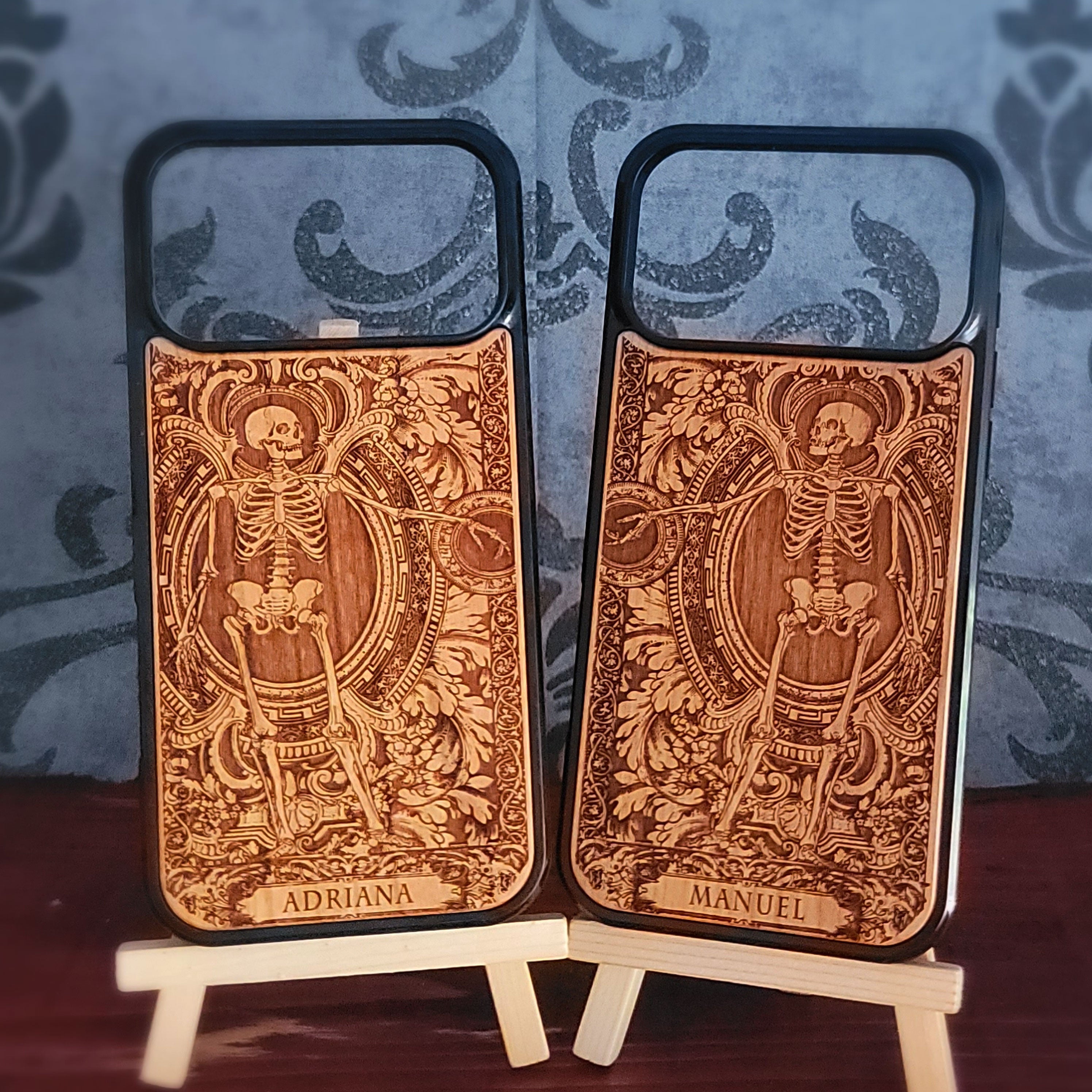 Laser-engraved wooden phone case featuring a detailed love couple skeletons with custom names