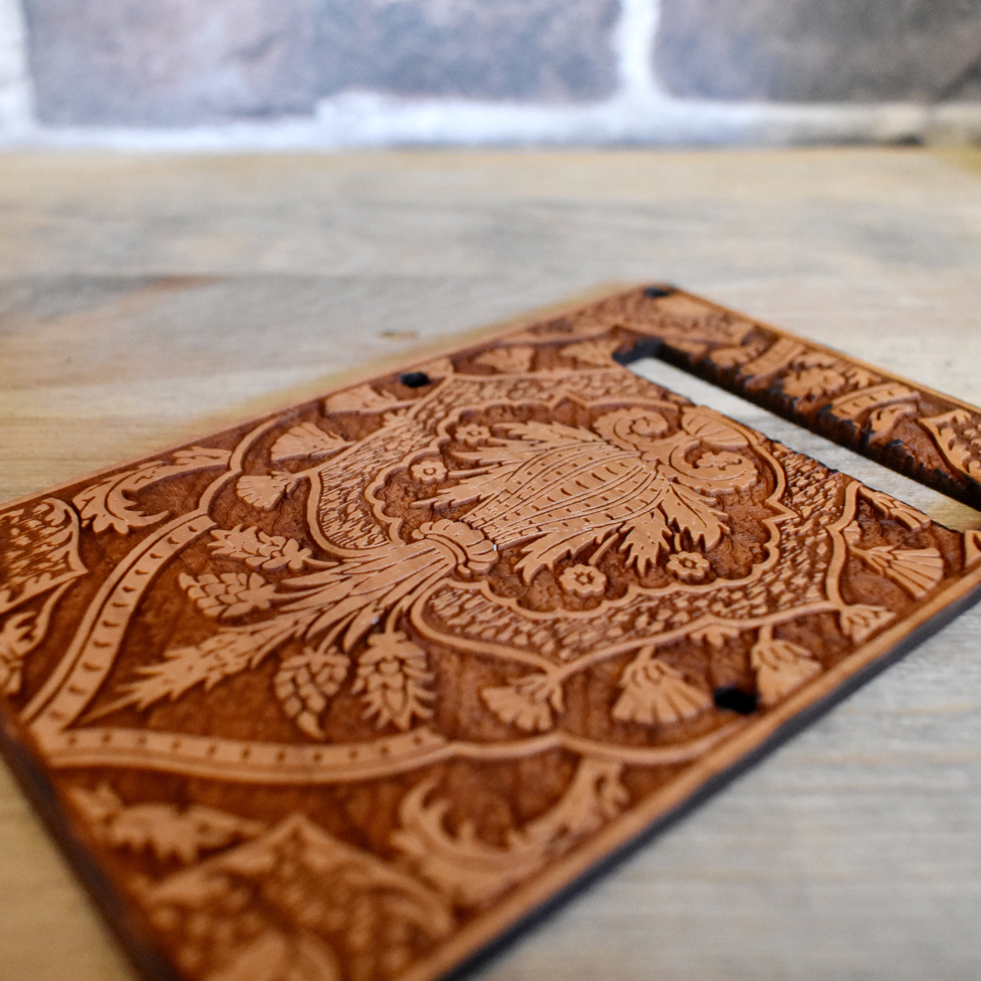 Hand-finished tremolo cover for Fender Stratocaster, made from cherry wood with intricate laser engraving