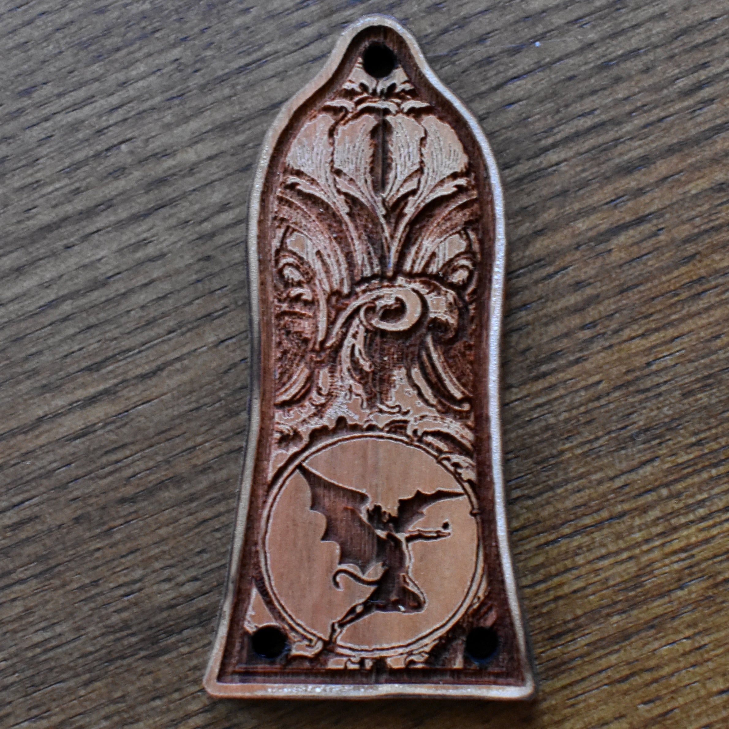 Black engraved truss rod cover for Epiphone guitar, featuring gothic floral design, handcrafted by Engraverβs Dungeon.