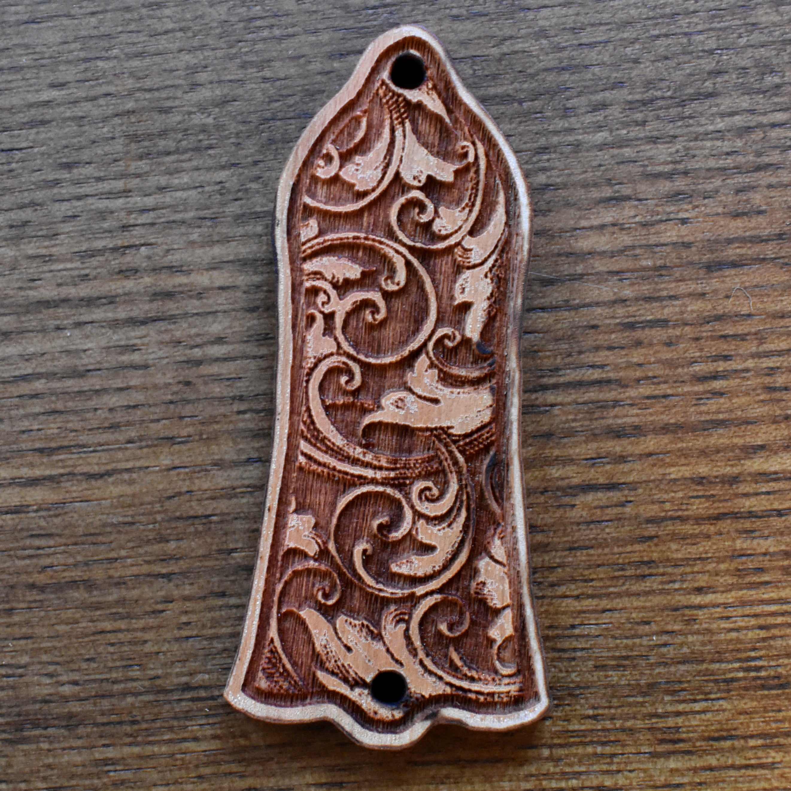 Engraved cherrywood truss rod cover for Gibson Les Paul, featuring ornate floral gothic pattern, handmade by Engraverβs Dungeon.