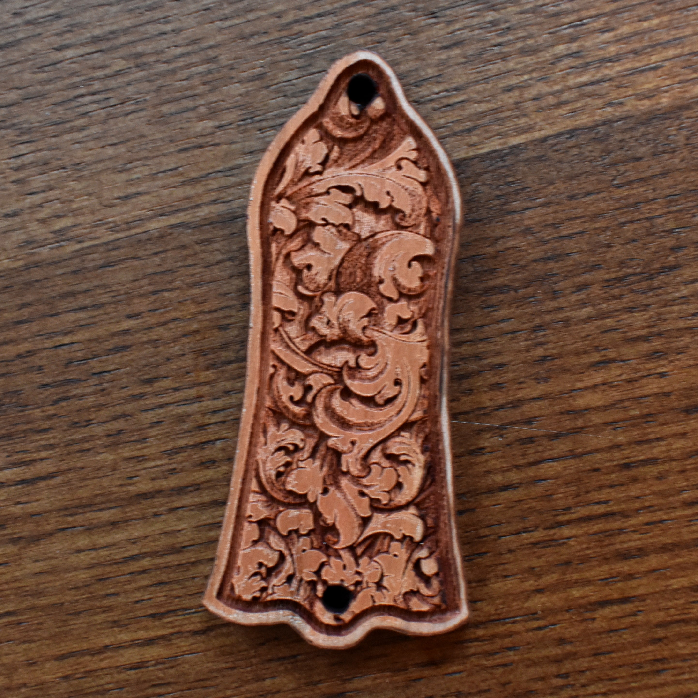 Custom cherrywood truss rod cover for Gibson Les Paul, featuring detailed floral engraving in gothic style, handcrafted by Engraverβs Dungeon.
