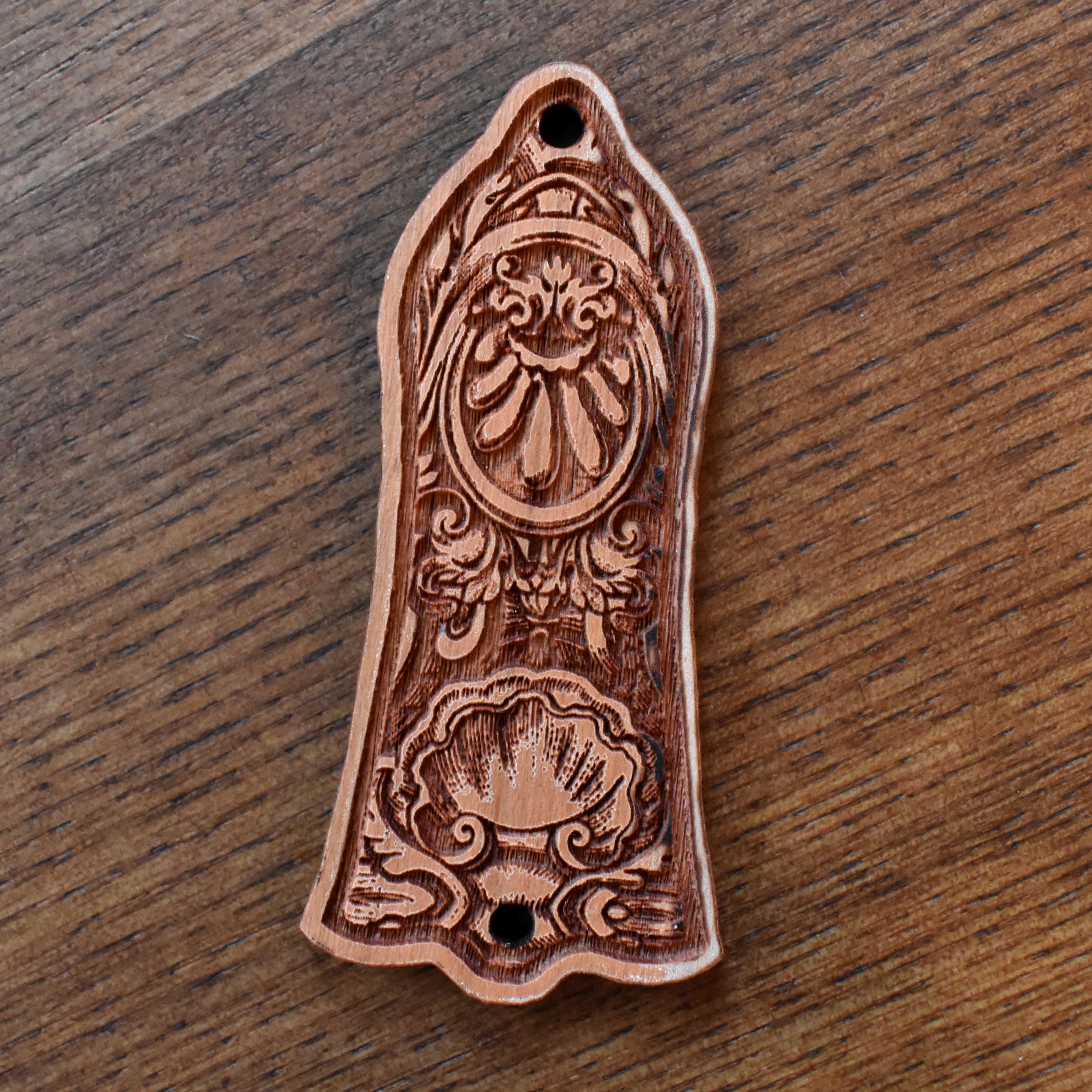 Handcrafted cherrywood truss rod cover for Gibson Les Paul, engraved with elegant floral gothic design by Engraverβs Dungeon.