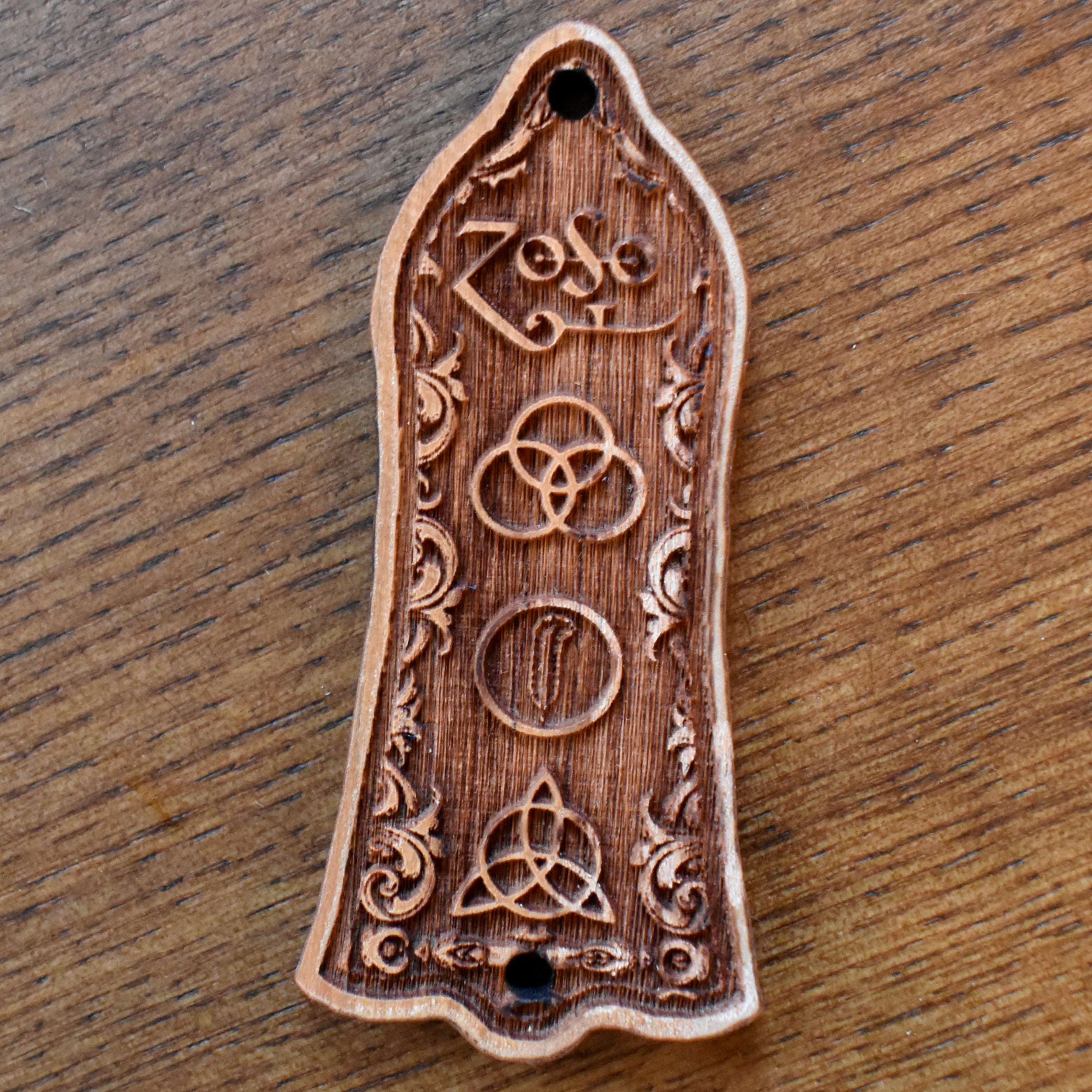 Engraved cherrywood truss rod cover for Gibson Les Paul, featuring Led Zeppelin inspired design, handcrafted by Engraverβs Dungeon.