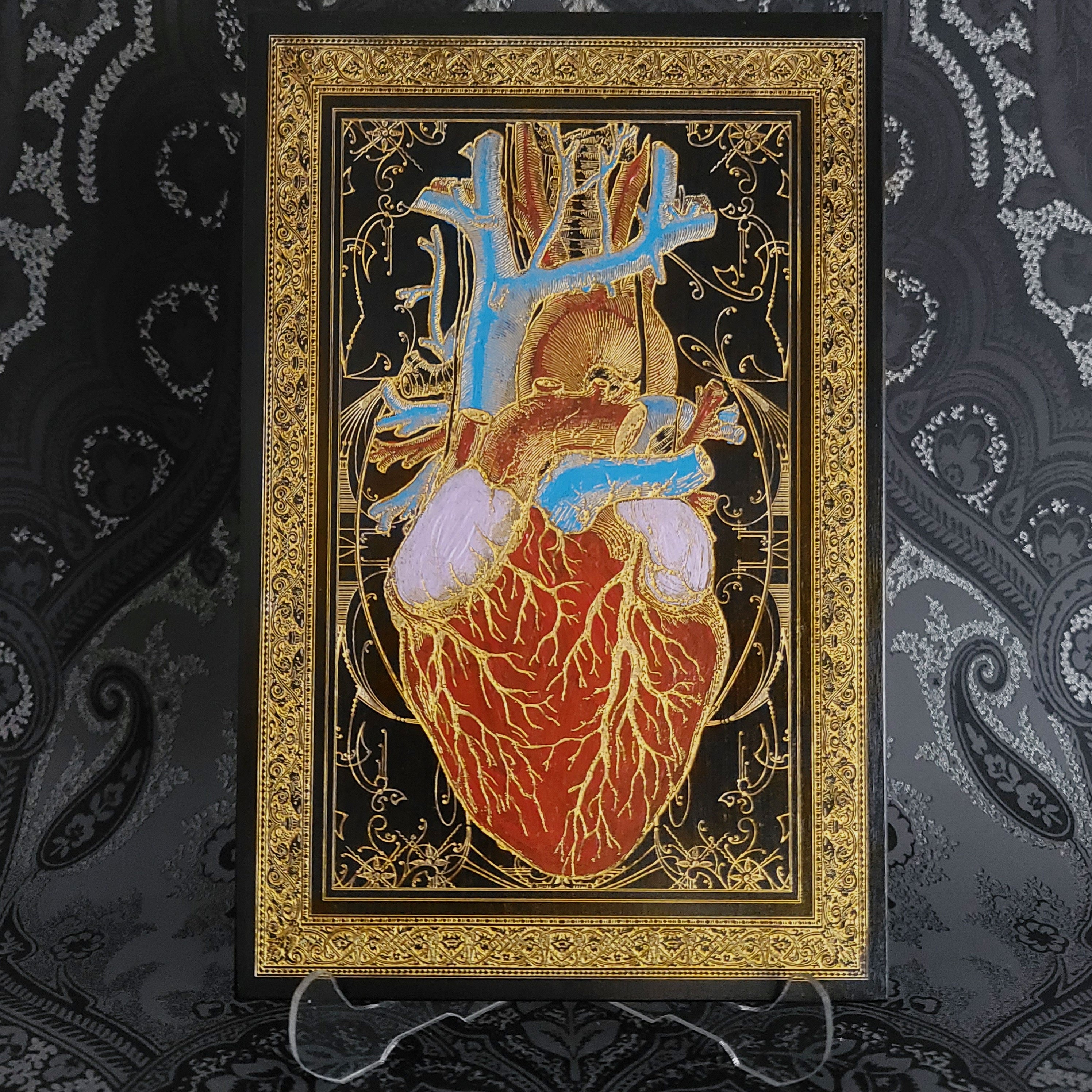 Black and gold anatomical heart wood wall art, perfect for gothic home decor.