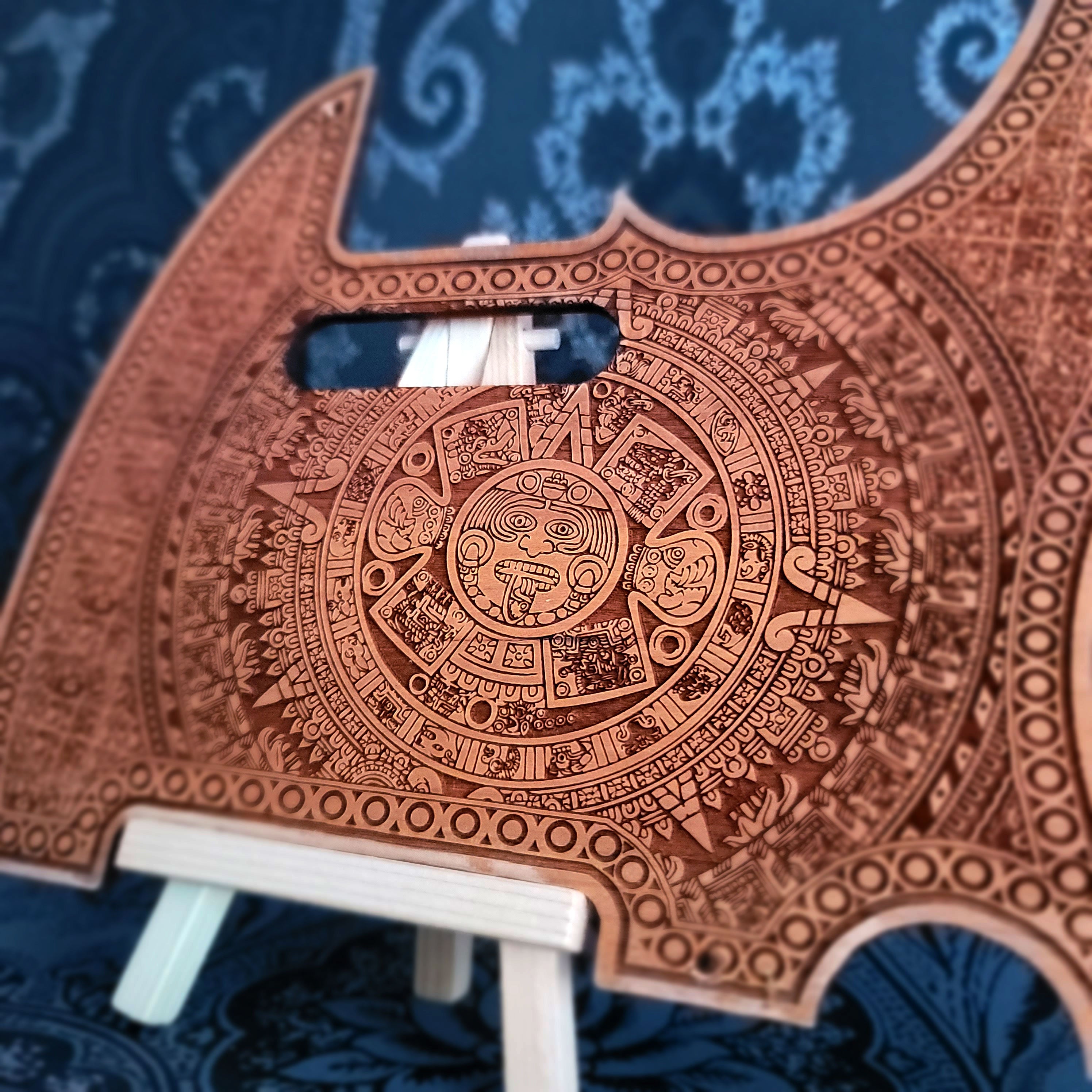 Aztec wood pickguard for Telecaster electric guitar, laser-engraved design.