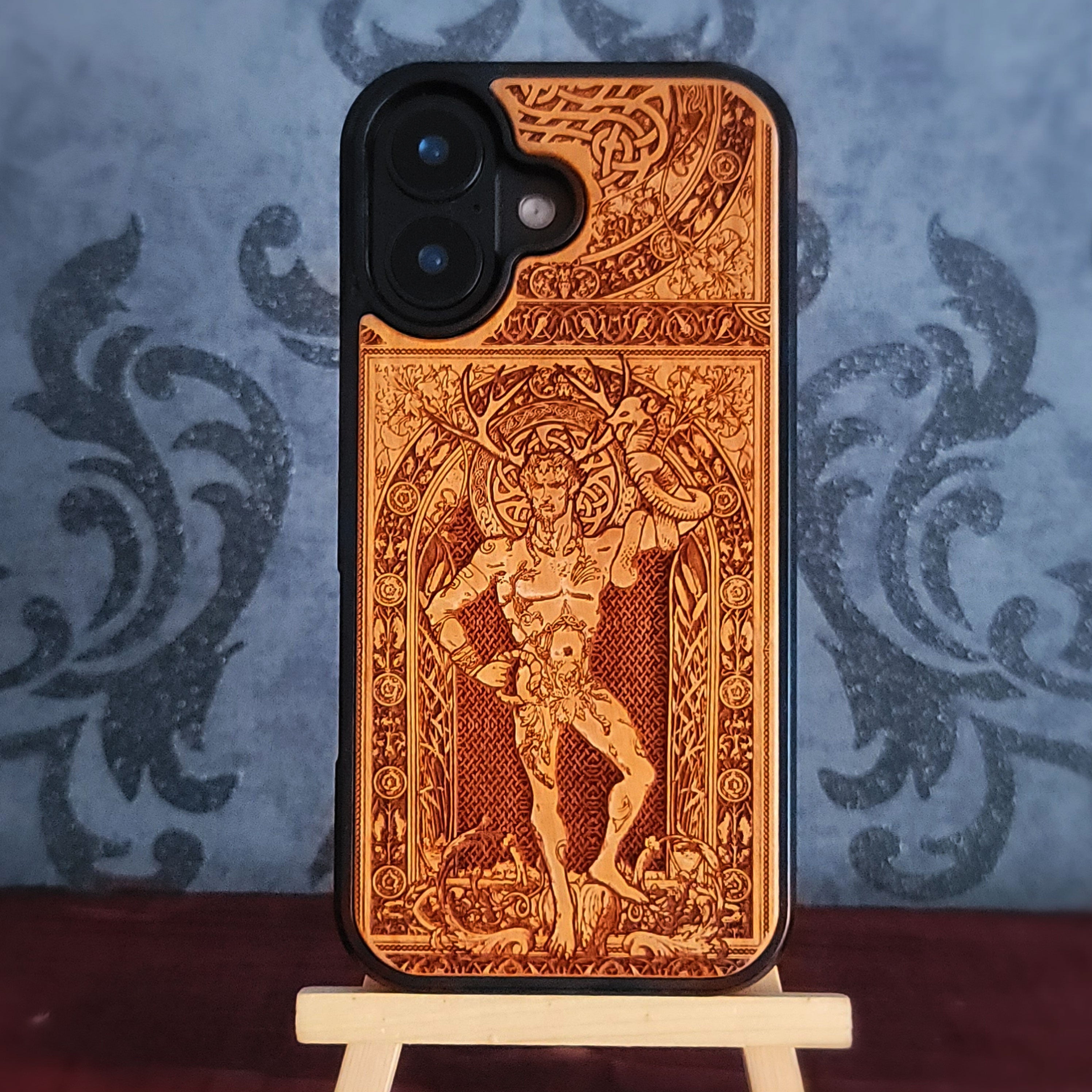 Wooden phone case featuring a detailed engraving of Cernunnos God, with Celtic-inspired design, compatible with iPhone and Galaxy