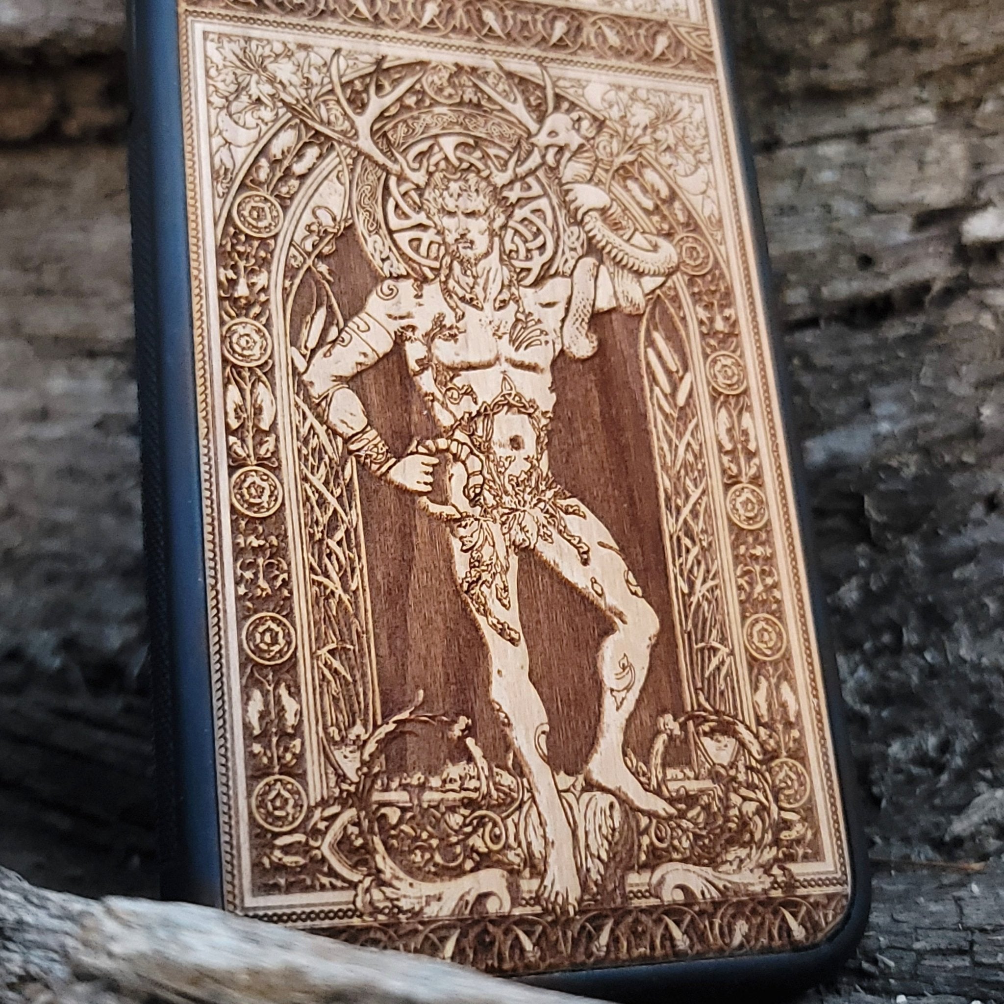 Wooden phone case featuring a detailed engraving of Cernunnos God, with Celtic-inspired design, compatible with iPhone , iPhone 15, Galaxy S, Note 20, and other models. Perfect for fans of gothic and Celtic art.