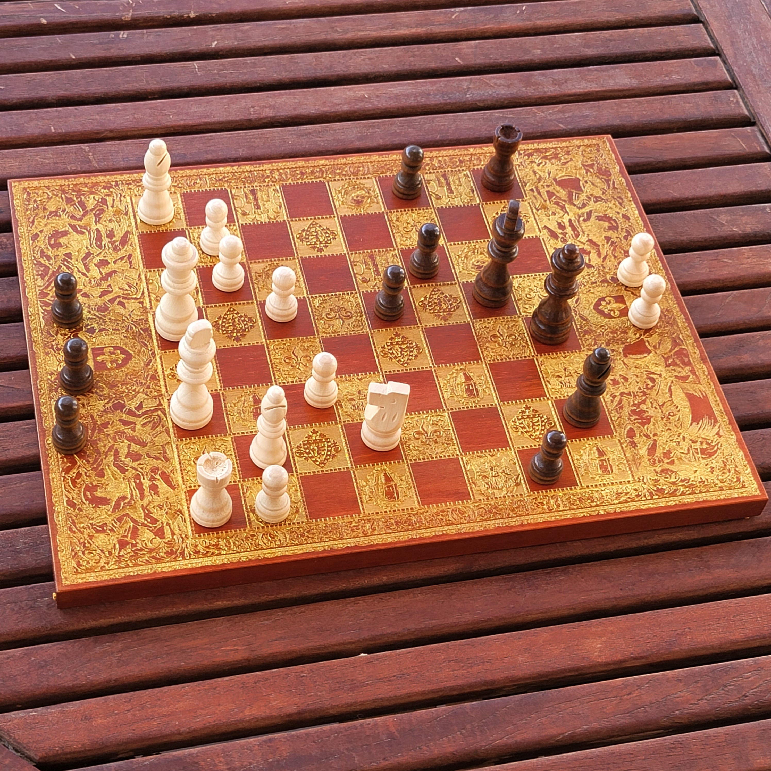 Elegant battle-themed chess set with detailed wood engraving, ideal for collectors