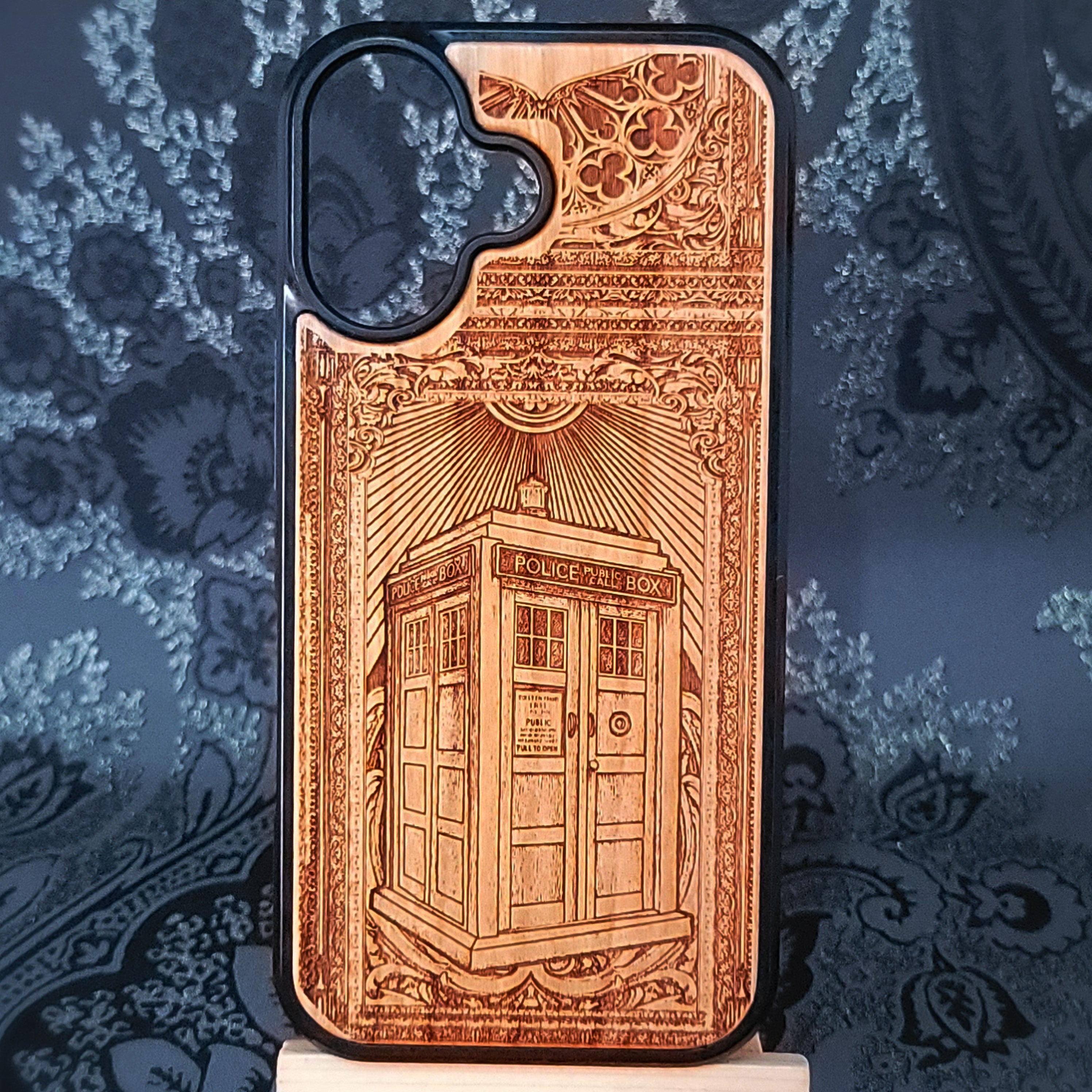 Deep laser engraved wooden phone case featuring a doctor who police box inspired sci-fi design on natural wood for iPhone and Samsung Galaxy models.