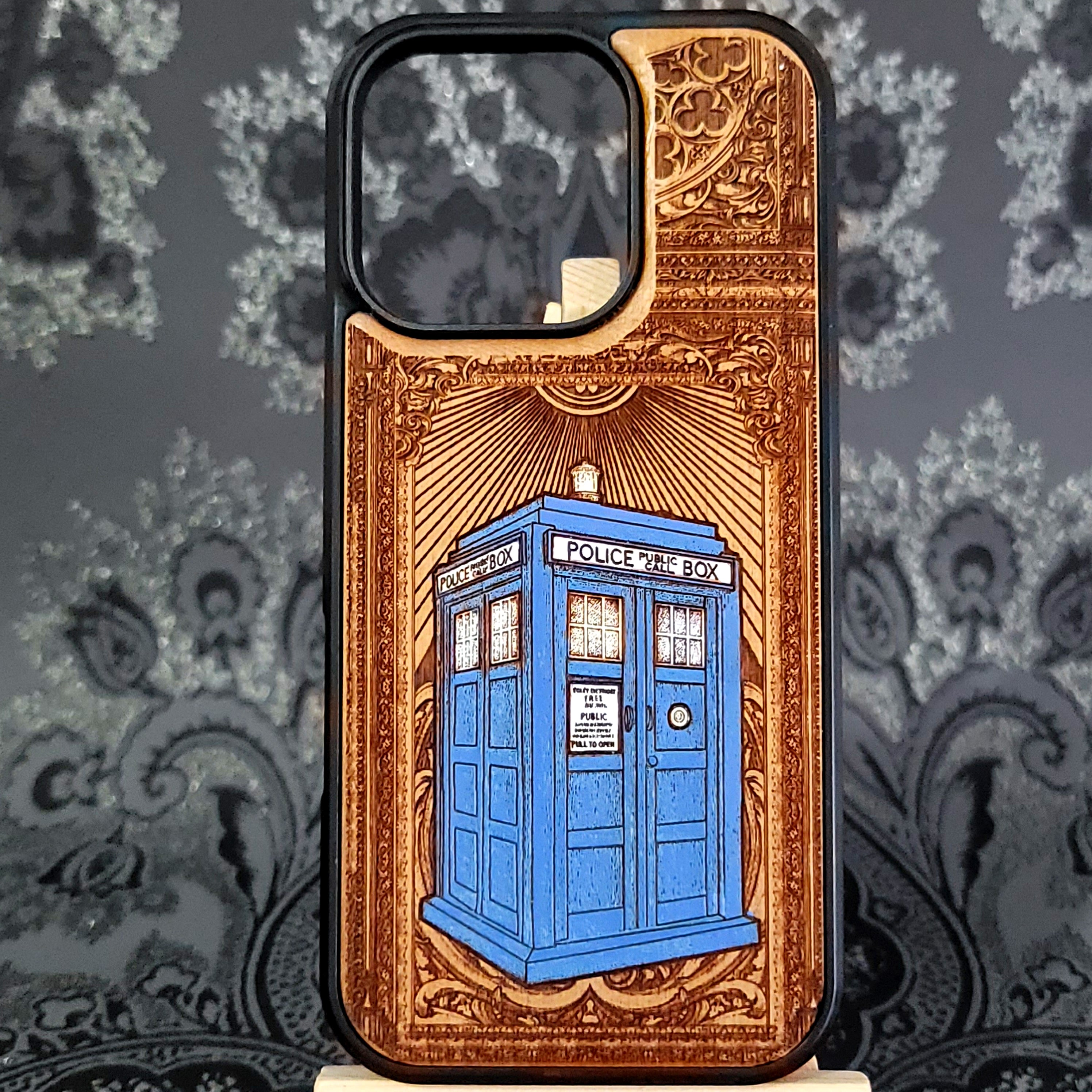 Deep laser engraved wooden phone case featuring a vintage police box inspired by classic time-travel sci-fi on natural wood for iPhone and Samsung Galaxy models.