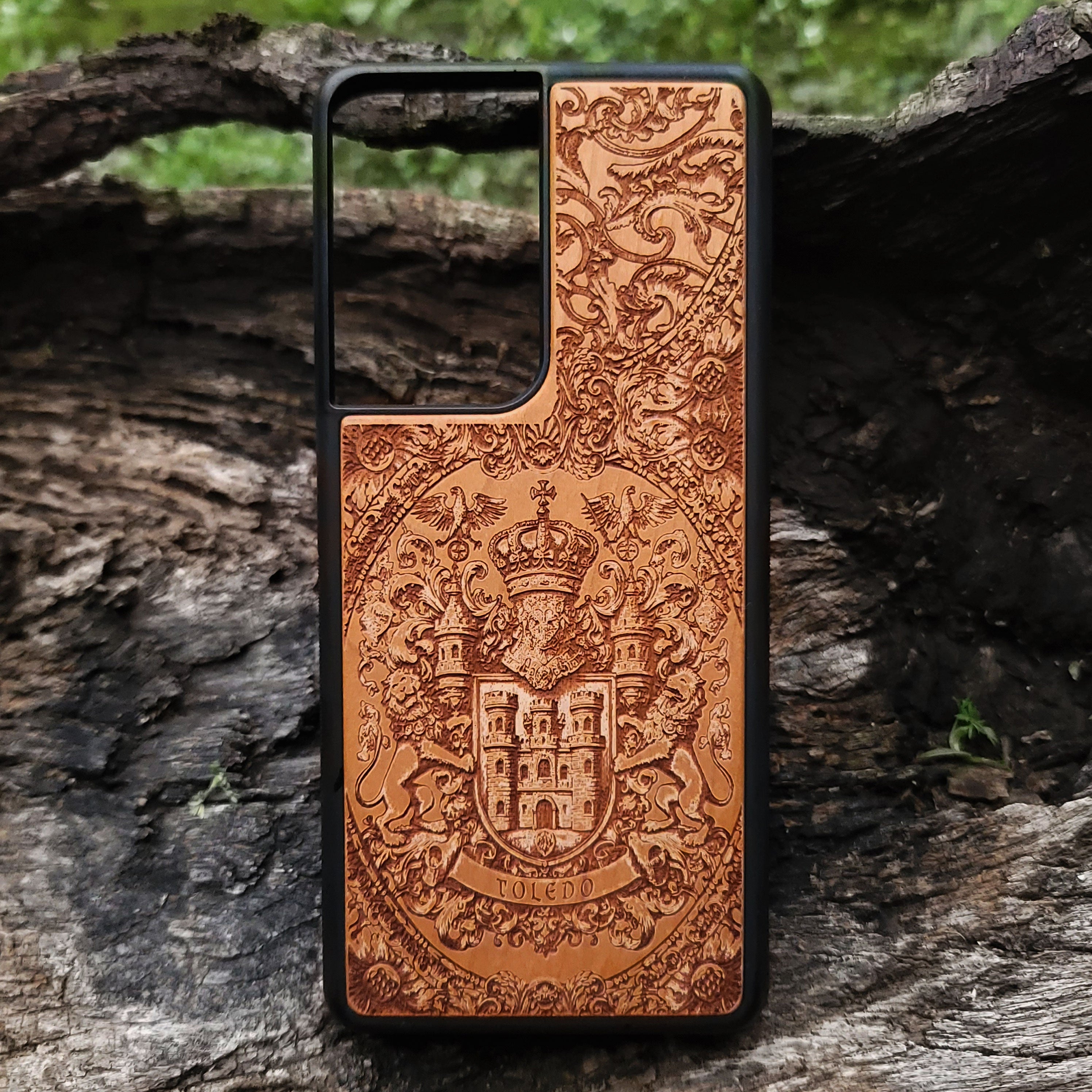 Heraldic Toledo shield engraved on wood phone case, ideal for genealogy fans.