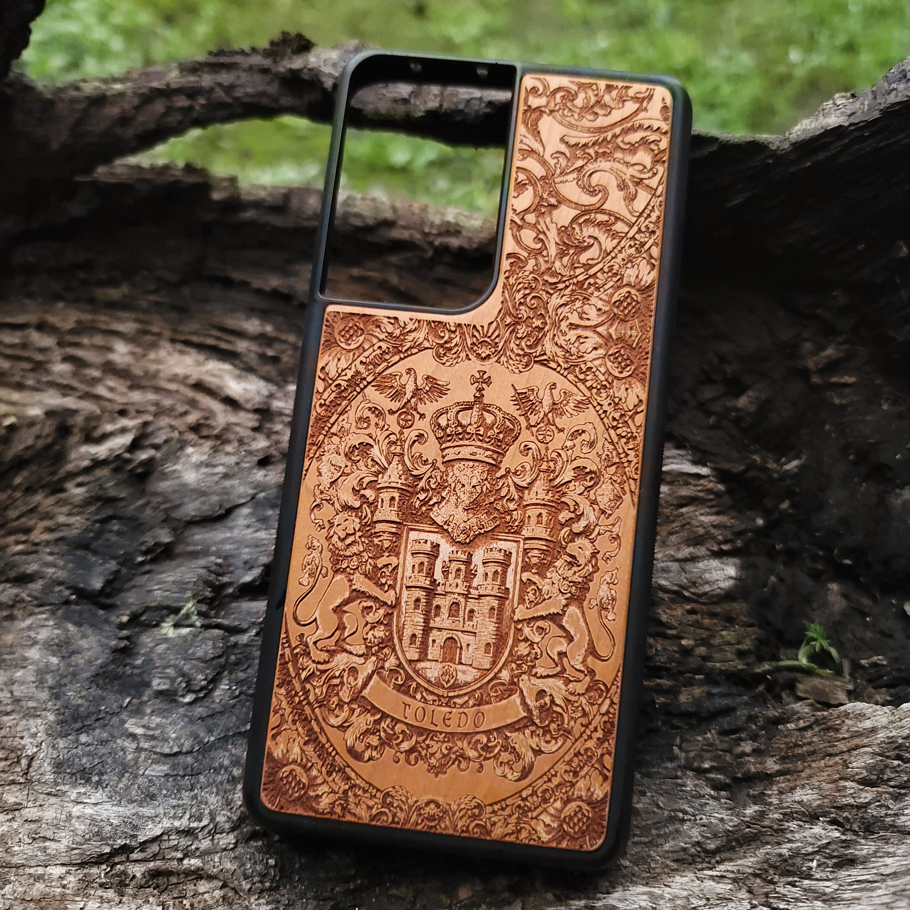 Toledo family crest phone case on durable natural wood, handcrafted finish.