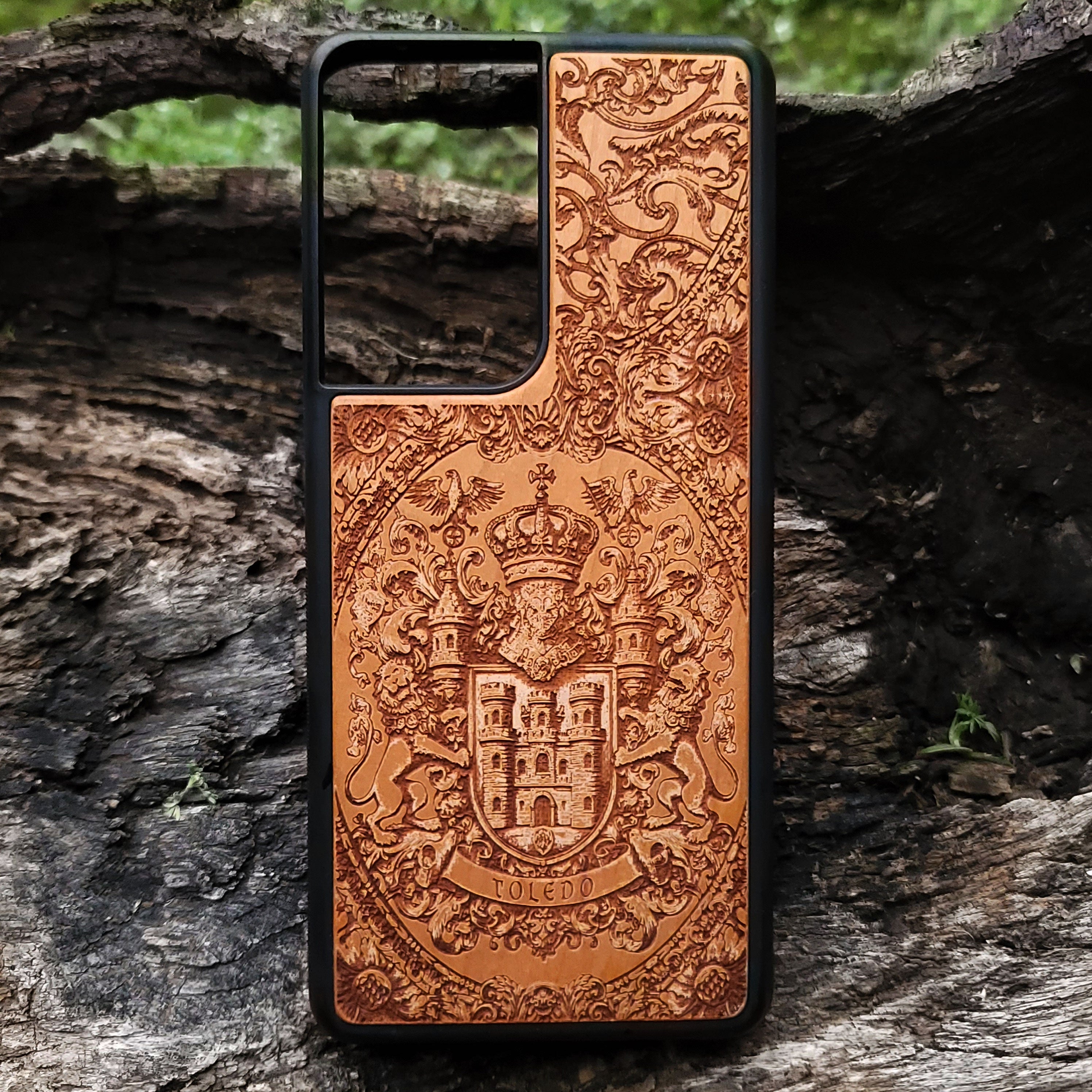 Wood phone case engraved with Toledo coat of arms, a gift for Spanish heritage lovers.