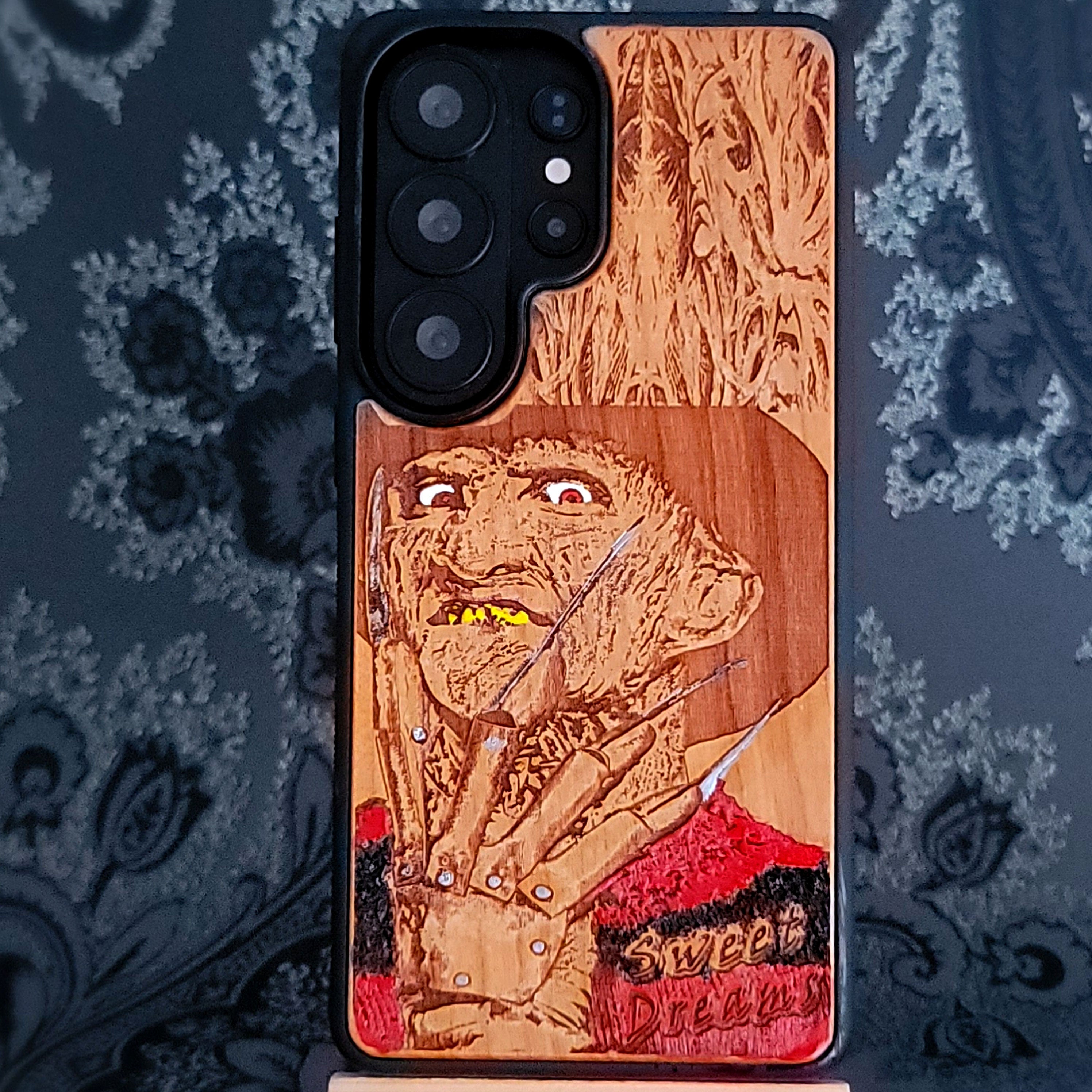 Hand-painted Freddy horror wood phone case for iPhone 16 and Galaxy S25, featuring nightmare slasher art design.