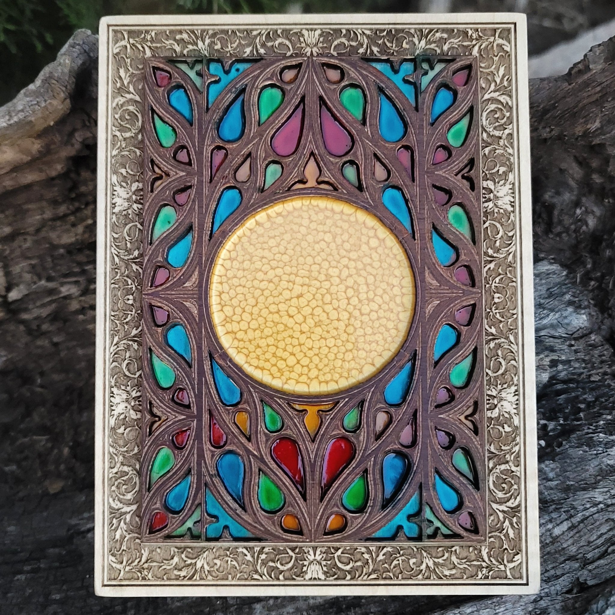 Custom gothic wood wall art shaped like a cathedral window with engraved symbol.