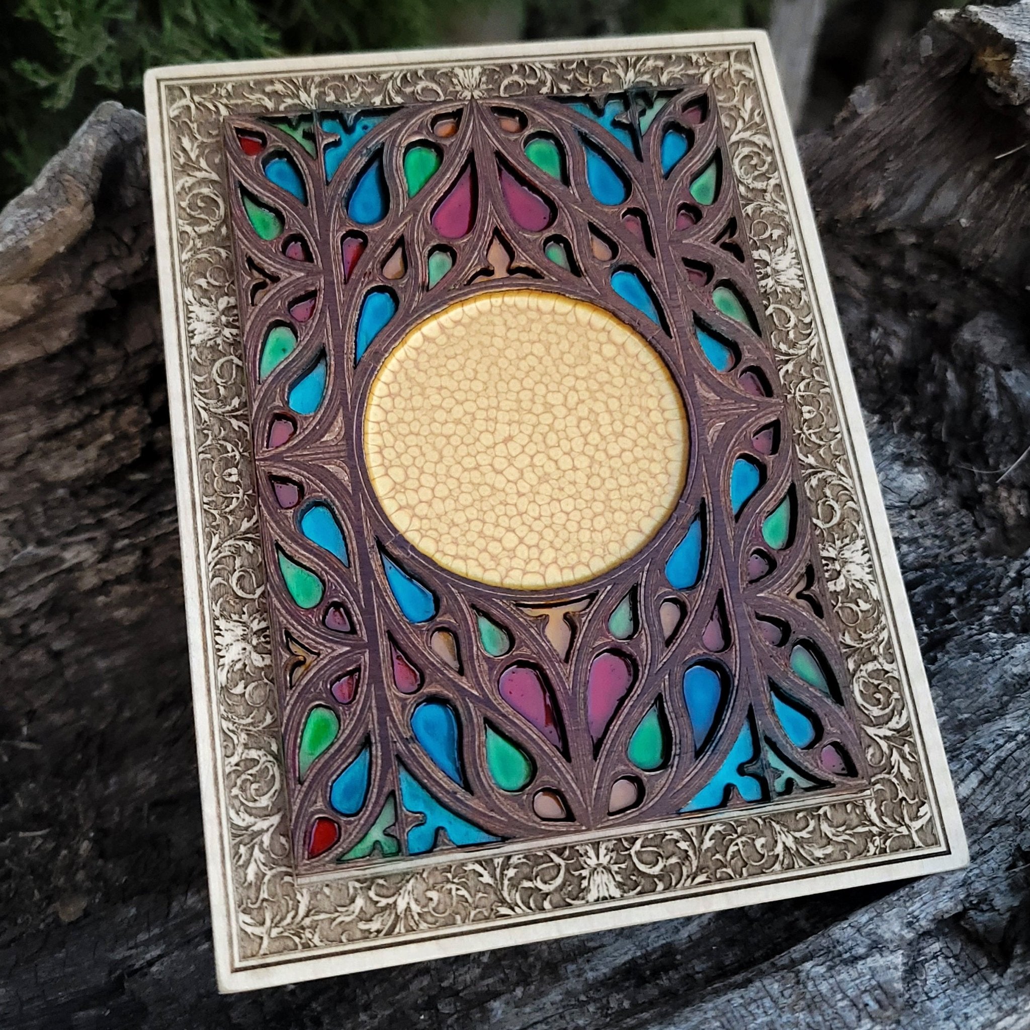 Custom gothic decor piece with stained glass effect and engraved crest or icon.