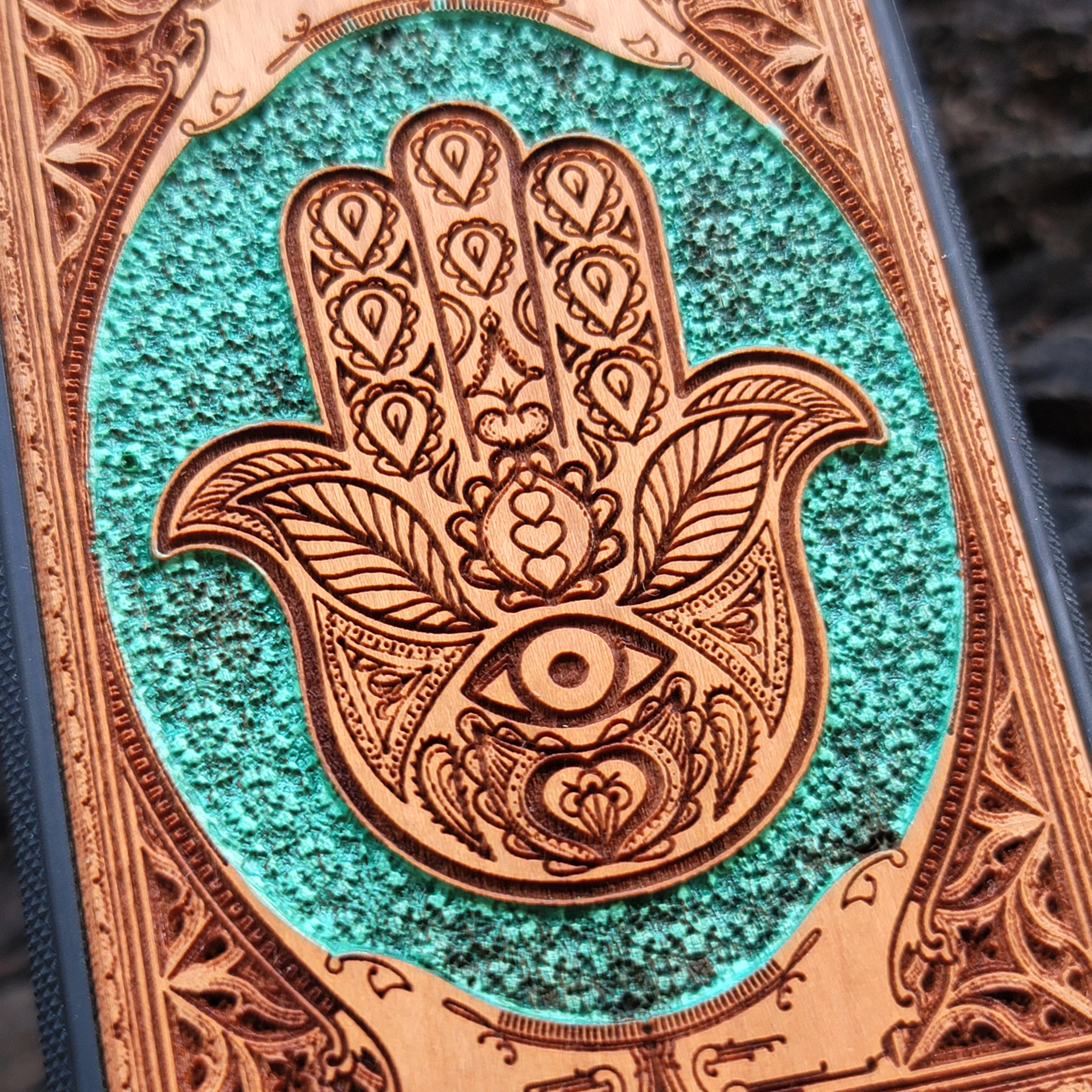 Hand-painted Hamsa Hand symbol wood phone case with Gothic pattern for iPhone & Samsung Galaxy. Laser-engraved design offers durability and style, compatible with iPhone , 15, 14, 13, 12, 11 Pro Max Mini & Samsung Galaxy S, S24, S23, S22, S21, S20 Ultra Plus Note 20.
