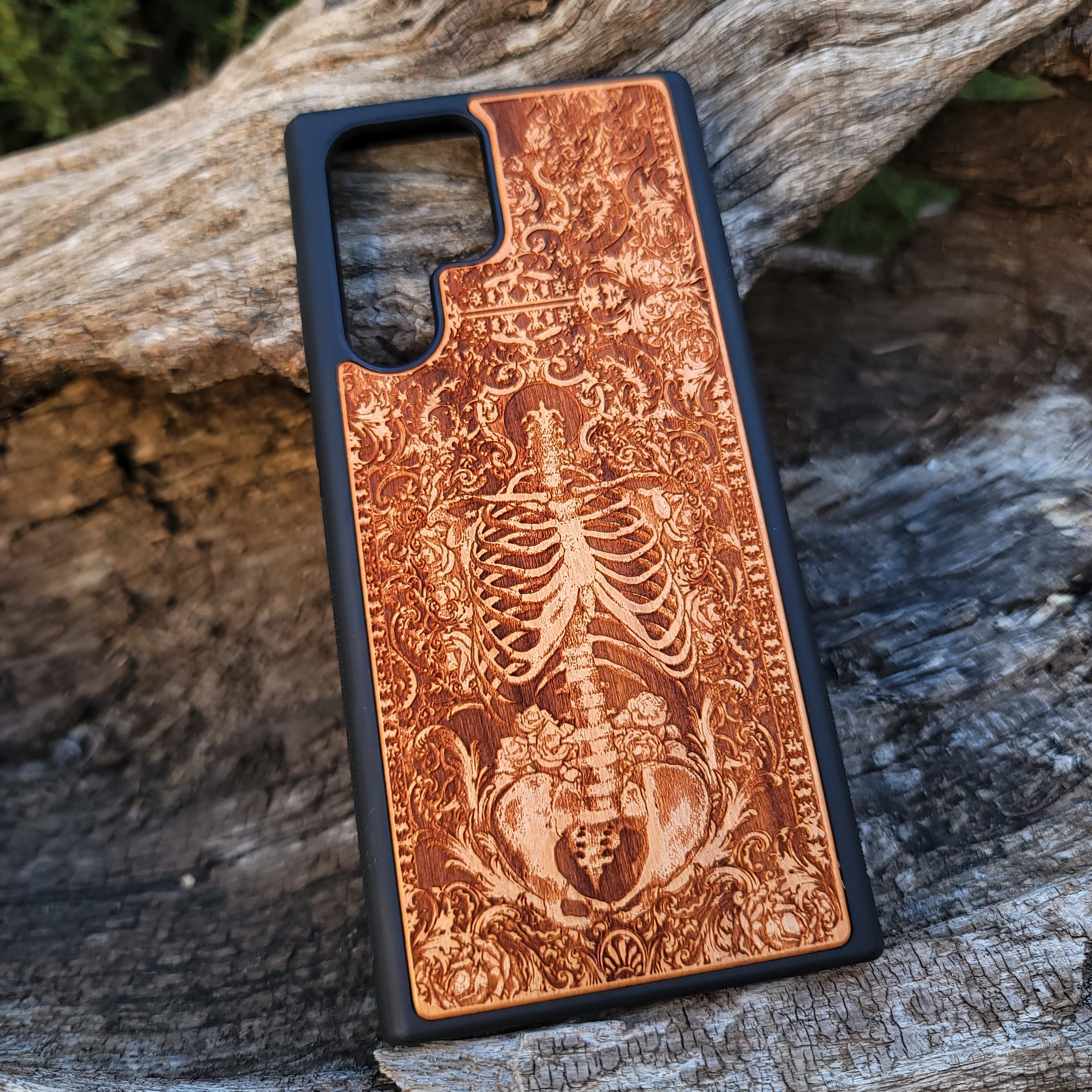 Wooden phone case with a detailed human skeleton torso and roses design, engraved for iPhone , iPhone 15, Galaxy S23 Ultra, Note 20, and more. Perfect for gothic art lovers seeking a unique phone accessory.