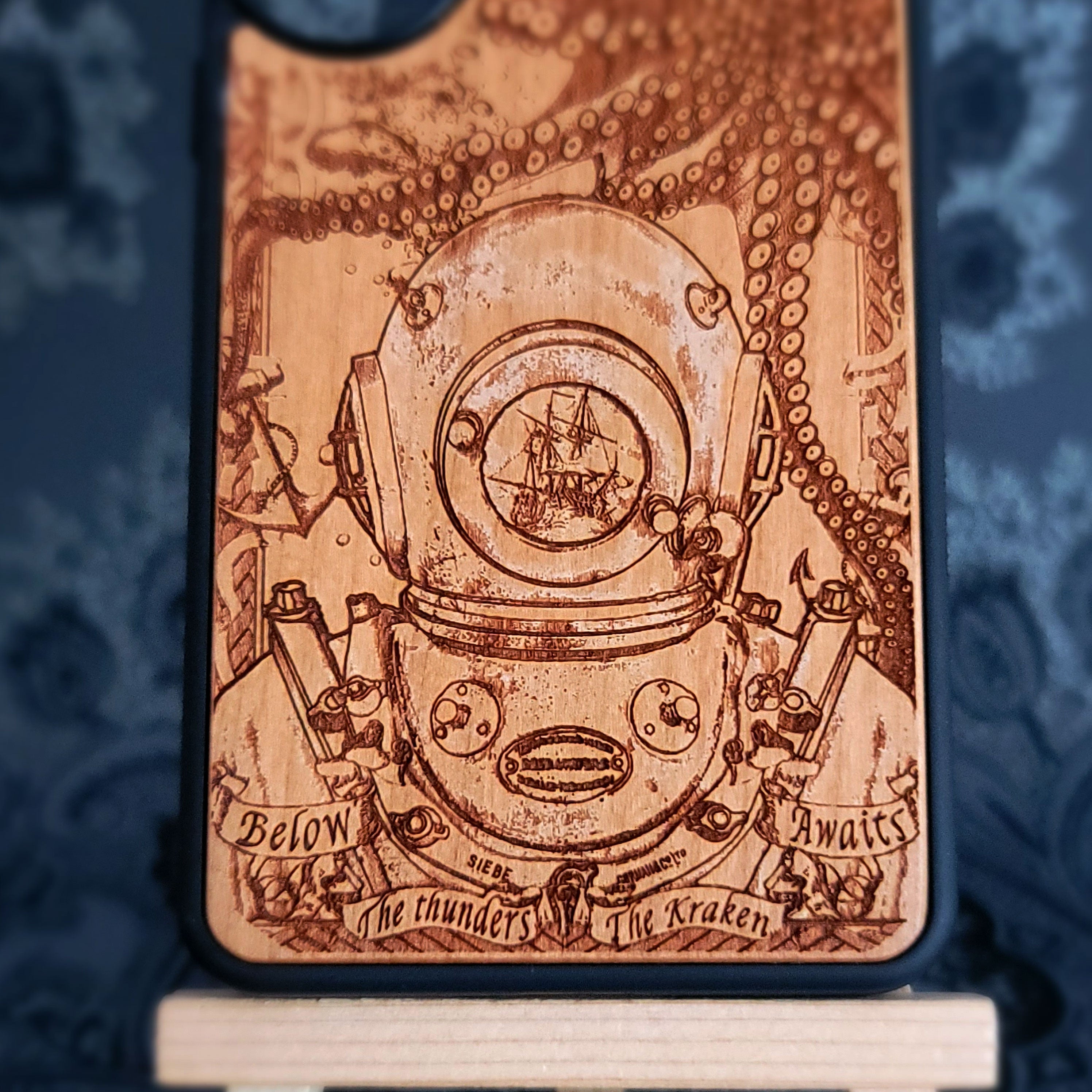 Wooden phone case featuring a detailed deep-sea diver and kraken design, laser-engraved for iPhone , iPhone 15, Samsung Galaxy S, and other models. A must-have for fans of nautical and mythical art.