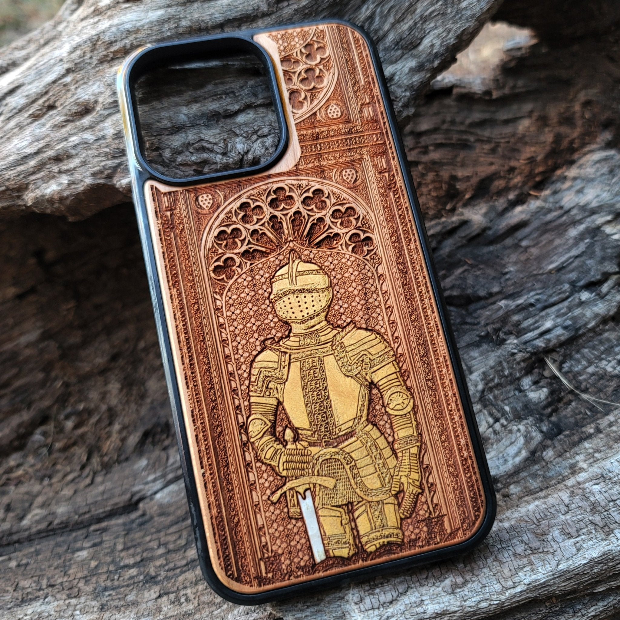 Wooden phone case featuring a medieval knight in armor, hand-painted with gold accents, laser-engraved on cherrywood. Compatible with iPhone -11 Pro Max, Galaxy S-S20. Historical and artistic phone case.