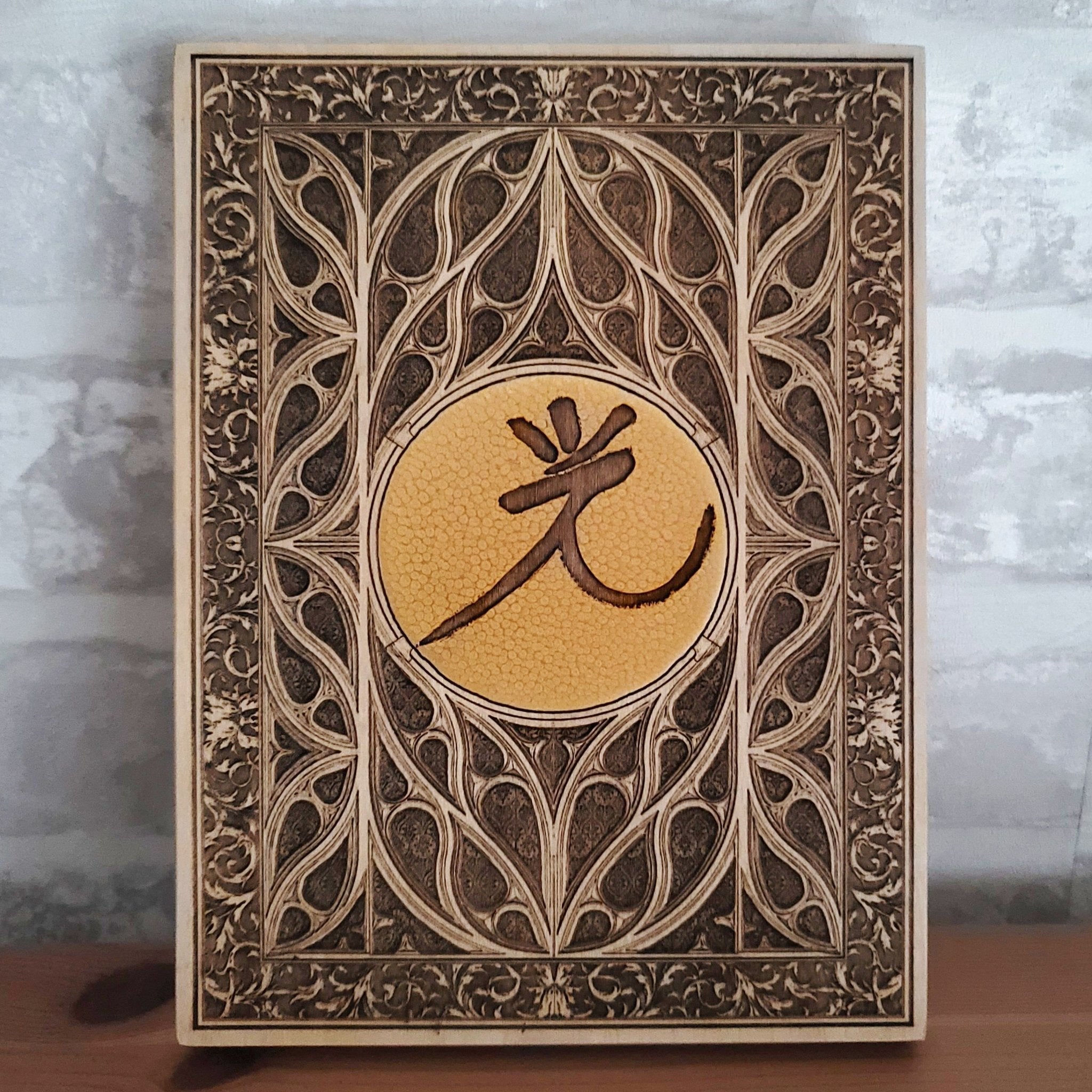 Custom gothic wood decor with a medieval window and personalized engraving.
