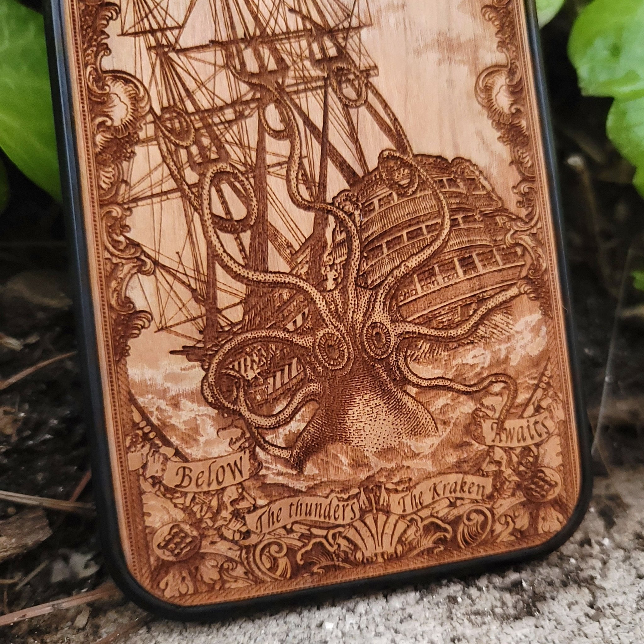 Wood phone case engraved with Kraken sea monster eating a ship, fits iPhone –11 and Samsung Galaxy S–S20