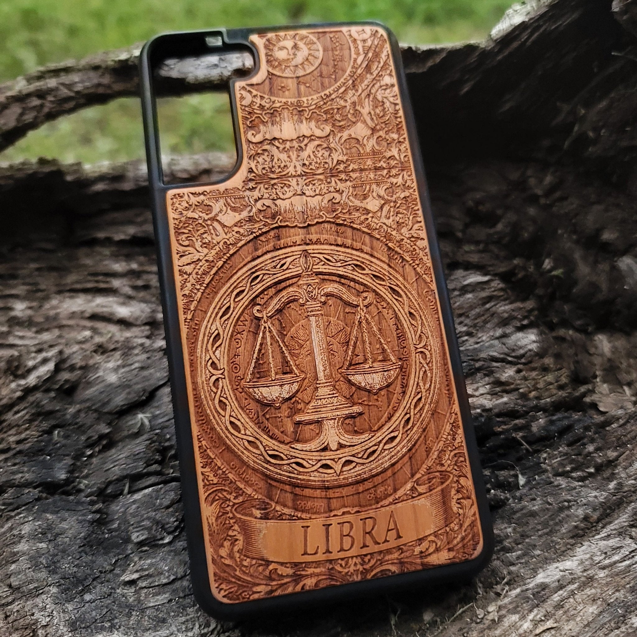 Detailed laser engraving of Libra zodiac on wood case