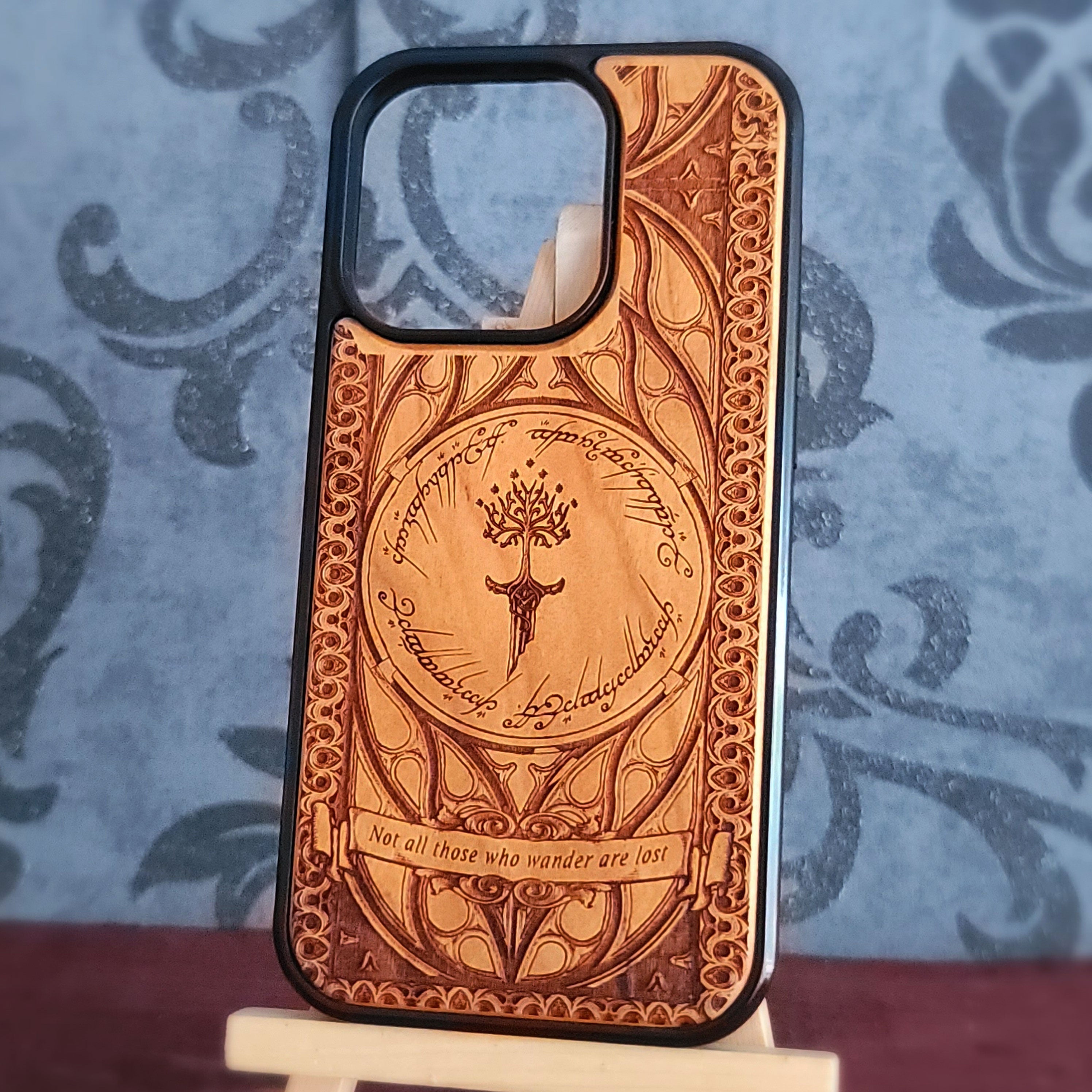 Lord of the Rings wood phone case featuring the White Tree of Gondor, Elvish script, and the iconic quote 'Not all those who wander are lost.' Laser-engraved for intricate detailing and crafted for durability, this case is compatible with iPhone and Samsung Galaxy